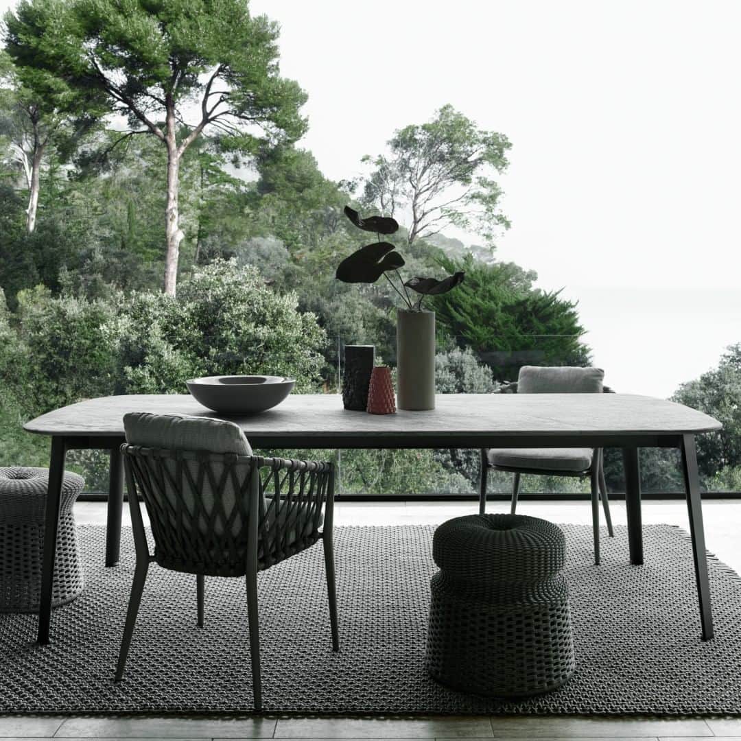 B&B Italiaのインスタグラム：「Antonio Citterio's Ginepro outdoor table showcases an anthracite painted aluminum structure and a precious Serpentine stone top, renowned for its durability. Crafted with high-quality materials, this table exudes timeless charm, ensuring its allure remains intact for years to come.  @antonio_citterio_arch  #bebitalia #design #OutdoorCollection」