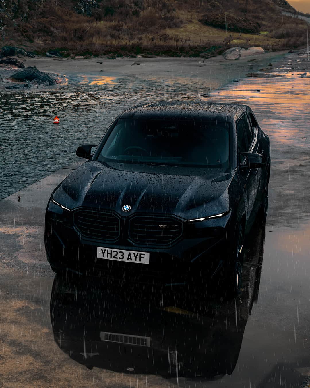 BMWのインスタグラム：「#BMWRepost 📸 @kabizzz @johnclarkbmw  Stunning at sunset ⛅️ The BMW XM . #BMWXM #BMW #BMWM #MHybrid #MPower __ BMW XM : Combined fuel consumption, weighted: 1.6–1.4 l/100 km. Combined power consumption, weighted: 35.8–32.9 kWh/100 km. Combined CO2 emissions, weighted: 36–32 g/km. All data according to WLTP. Further info: www.bmw.com/disclaimer」