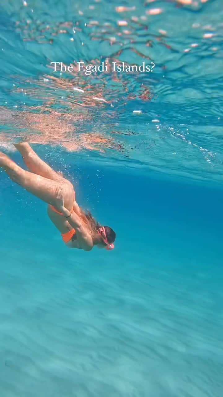 アリサ・ラモスのインスタグラム：「If my face looks a bit frustrated, it’s because I was😂 But I still had an incredible time!!  This stunning remote island area is called the Egadi Islands (or Isole Egadi), located in Trapani, Sicily! I went here specifically to see these islands and fall in love with the town, and then buy a small investment property there. (Yes that is how my mind works)  But, after flying, driving, and boating to get there, we had an overcast windy day, and a jellyfish attack the first swim (see previous post), plus exhaustion from traveling nonstop for 4 weeks, and my face turns out like a snarl 😂  I am definitely going back to Trapani though for a re-do of the Egadi Islands, and would highly recommend it for everyone who has Sicily on their bucketlist! Blog coming soon!  Can you tell i had a massive triple jellyfish sting from this video? Could you imagine still trying to film for work with one??  #attackofthejellyfish #jellyfish #egadiislands #isoleegadi #sicily #trapani #italy #europeansummer #mylifesatravelmovie」