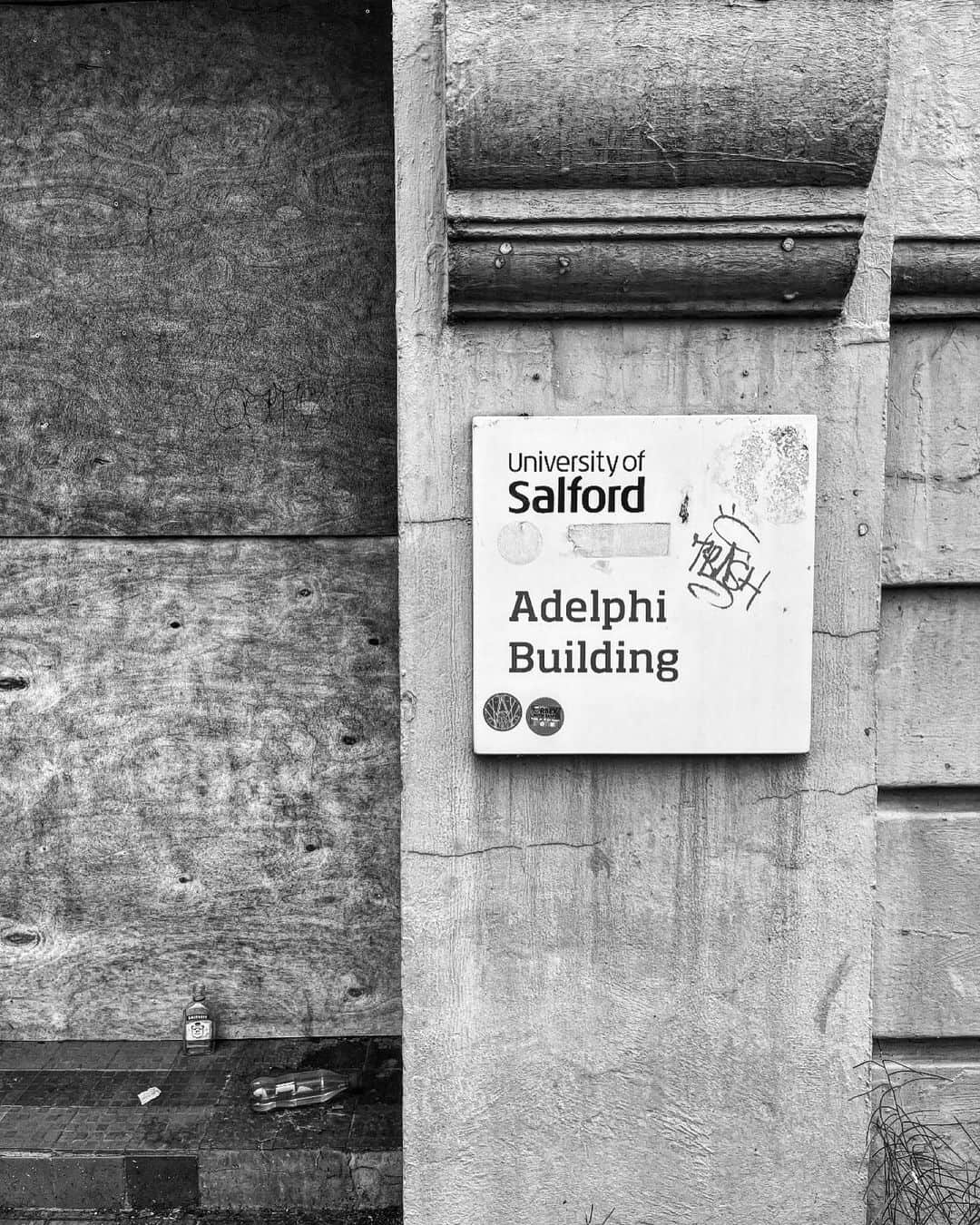 のインスタグラム：「Abandoned warehouse party -  Had a day off in Manchester today so took a walk to my old College building in Salford. Was sad to see it all boarded up and occupied by Pigeons..but did laugh at the empty Vodka bottle and half bottle of urine on the front entrance step.   A lot of ghosts in this building. A place filled with peoples ideas and dreams. I found mine in here.  I could still here the faint sound of someone playing the trumpet as I walked the corridor in search of a cigarette and a pot noodle   X  #universityofsalford #salford #manchester」