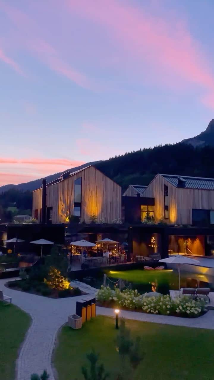 BEAUTIFUL HOTELSのインスタグラム：「@naturhotelforsthofgut brings you a breathtaking view of the pink-hued sky behind their charming cabins. 🌆  400 years of history and a deep love for nature echo through every corner of this unique hotel. 🌳 Set against the majestic backdrop of the Leogang Rock Mountains, the Forsthofgut provides the perfect base for year-round exploration and adventure. ⛷️ Whether you’re skiing in winter or exploring nature’s wonders in warmer months, the hotel’s surroundings are nothing short of enchanting. 🌷  Isn’t it time you experienced this picturesque paradise for yourself? 💫  📽 @naturhotelforsthofgut 📍 Naturhotel Forsthofgut, Austria 🎶 lumadeline - Lana Del Rey - Young and Beautiful」