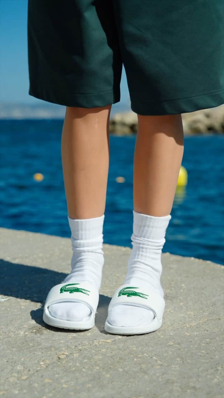 Lacosteのインスタグラム：「Slip into the timeless style of the iconic Lacoste slides 🐊  and embrace their legendary comfort. 😍 Get ready to turn heads and set trends with every step you take! #LacosteSummerVibes ☀️」