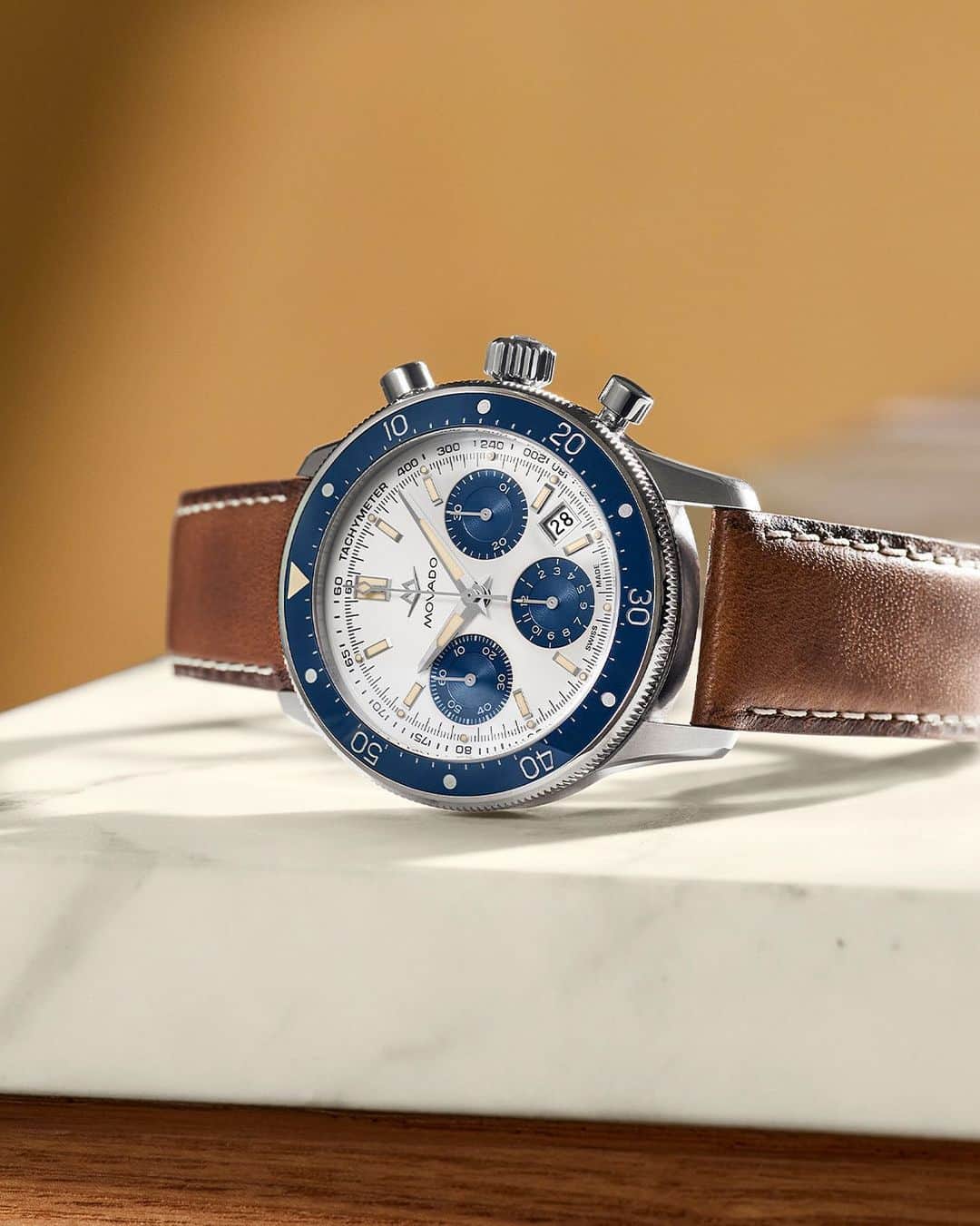 モバードのインスタグラム：「Dive into our archives with this exquisite #MovadoAlta Super Sub Sea timepiece—the pinnacle of midcentury modern design crafted with a luxurious strap of smooth cognac leather. Exclusively on Movado.com」