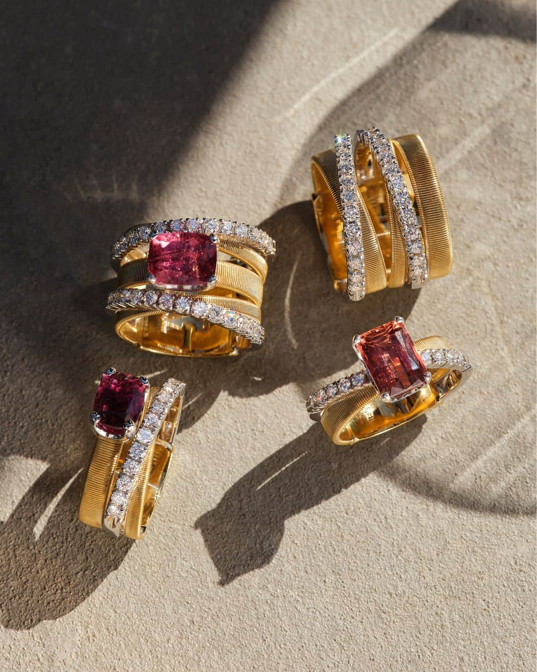 マルコ ビチェゴのインスタグラム：「Shimmering sophistication in every detail. Explore our Masai rings with diamond-studded plaques and cushion-cut vibrant raspberry rubellites. A stunning sensation that is perfect for everyday wear. #marcobicego #highjewelry #gold #diamonds #gemstones #madeinitaly」