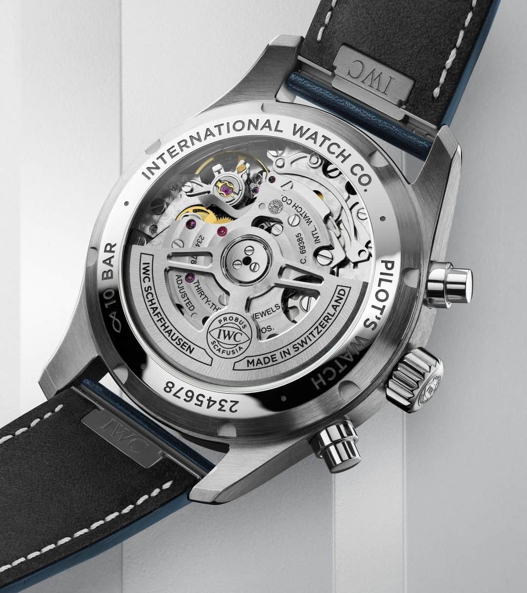 IWCのインスタグラム：「The see-through sapphire case back perfectly displays some of the 242 components and 33 jewels that make up our in house 69385 calibre movement.  #IWCpilot | #TheReference  🔗Link in Bio  ℹ Blue dial Stainless steel case 41mm EasX-CHANGE system IWC-manufactured 69385 Calibre Ref. IW388101」