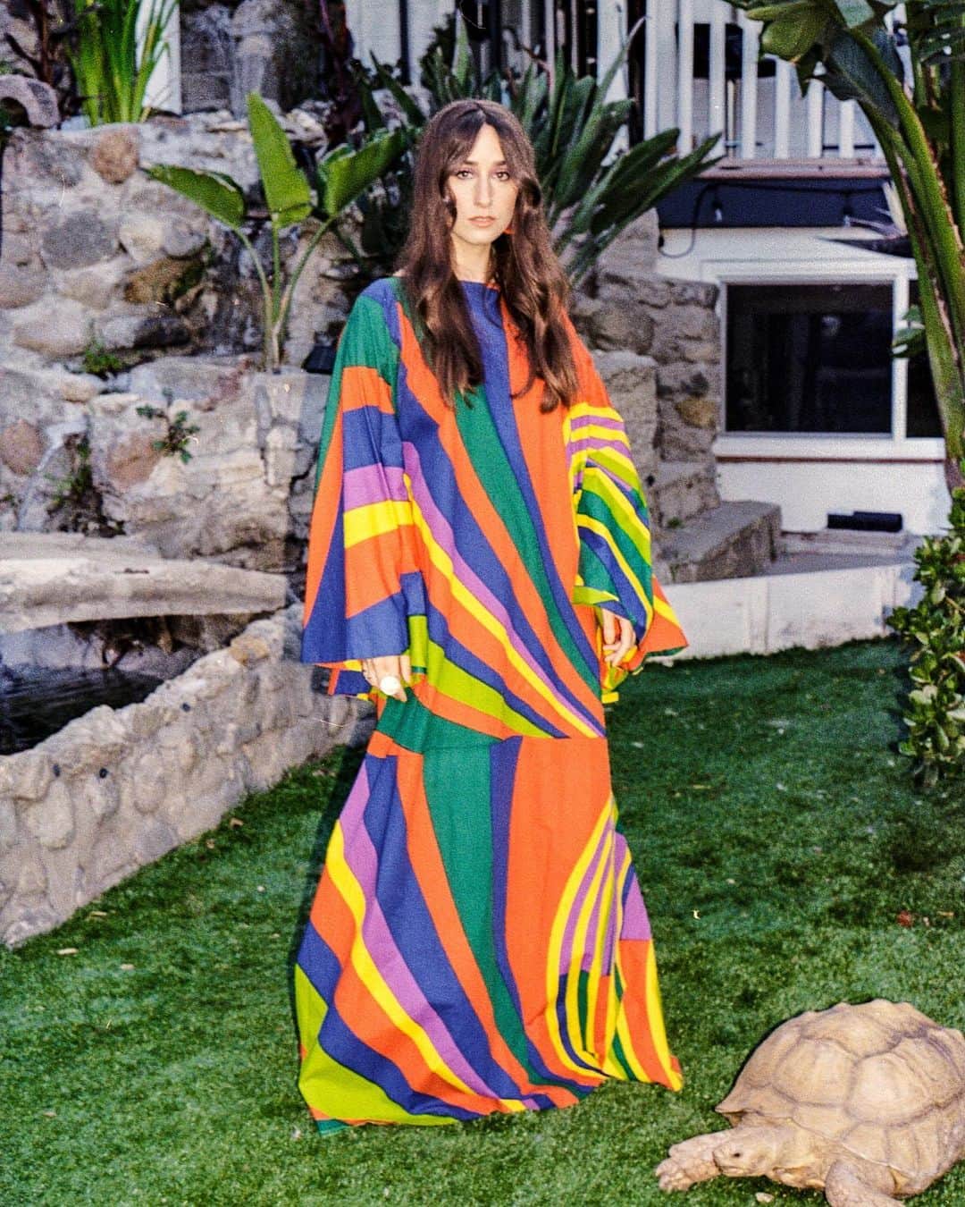 マリメッコのインスタグラム：「LA-based musician STACEY, @staceymusic wearing a beloved vintage Marimekko treasure: Our Terese dress in the Kangastus print, designed by Pentti Rinta in 1974. 🌈  "Clothing is a huge part of my artistic expression and serves as a visual extension of my music. I immediately fell in love with this piece when I found it", writes STACEY.  Taken by photographer Laura Moreau @laurasnowhere with hair and make-up by Christina Spina @christinaspinamua」