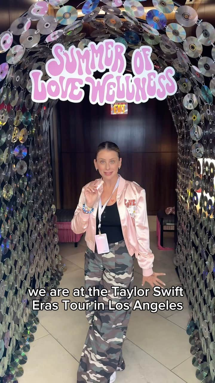 ロー・ボスワースのインスタグラム：「Our Founder @lobosworth is taking you on a tour of our Love Wellness Lounge at the Eras Tour 💖   Each activation represents one of our 6 products that are now available at @walmart 💙 🩵 Good Girl Glam  ⚡️ Killer Tattoos 🌸 Flora Power Hair Flare 💚 Gut Feelings Bracelets ✨ Sparkle Fiber photos/patches ☁️ Bye Bye Bloat cotton candy pops  It truly was a night from our wildest dreams!!」