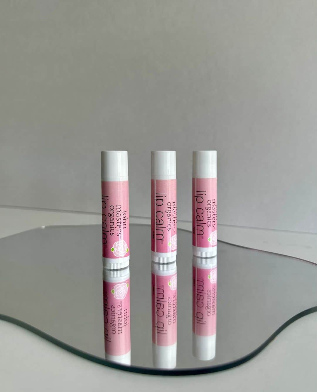 John Masters Organicsのインスタグラム：「Our Limited-Edition Rose Lip Calm is BACK for a limited time only! 🌹⁠ ⁠ Enriched with the essence of roses, this Lip Calm revitalizes and moisturizes, leaving your lips feeling velvety smooth and enhancing their natural beauty. 👄⁠ ⁠ Grab yours now on our website, only available while supplies last! ✨」