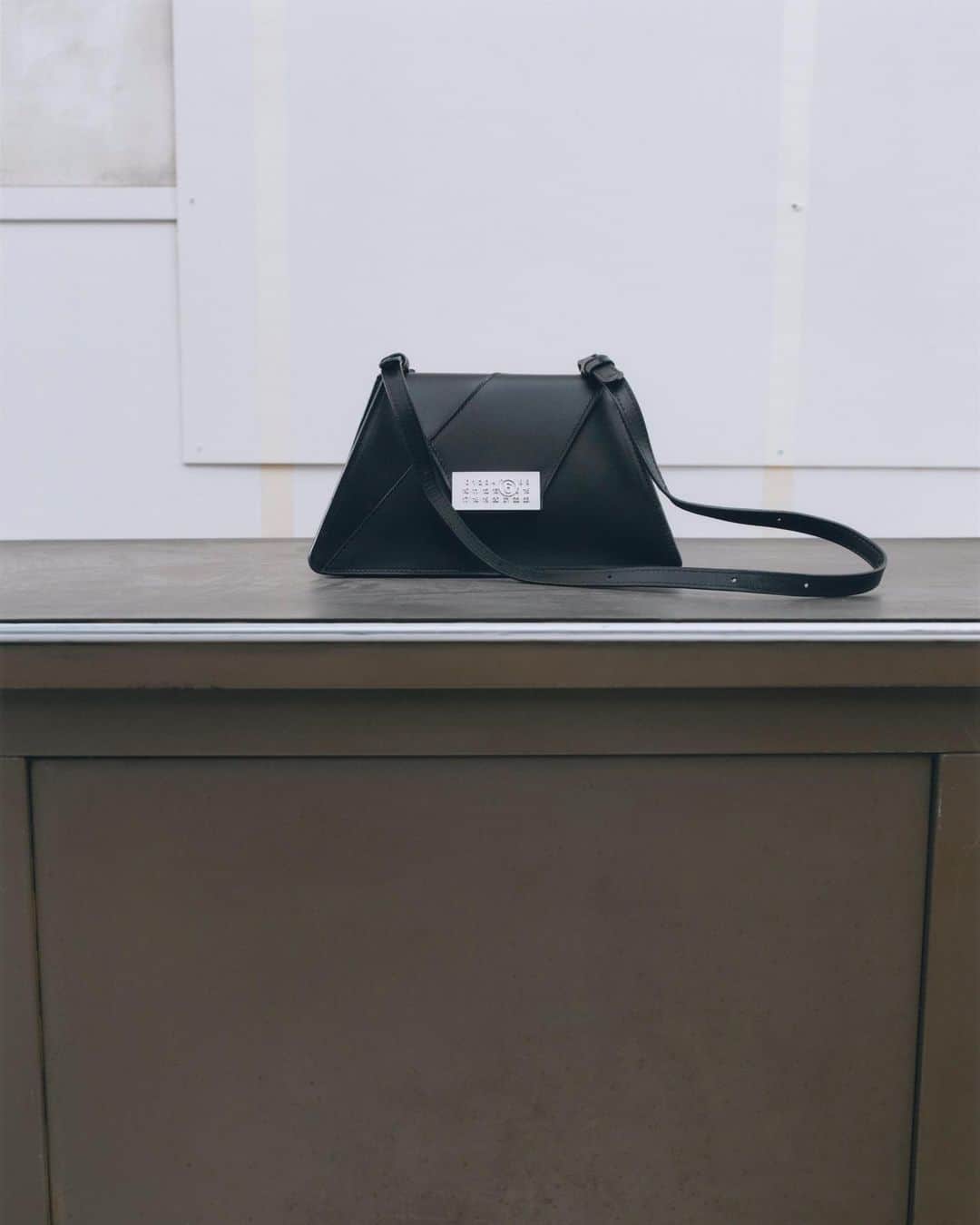 のインスタグラム：「#MM6 Maison Margiela Numeric Bag. The new triangular design combines the Japanese line aesthetic with a the new numeric signature.  Available in store and online.⁣」
