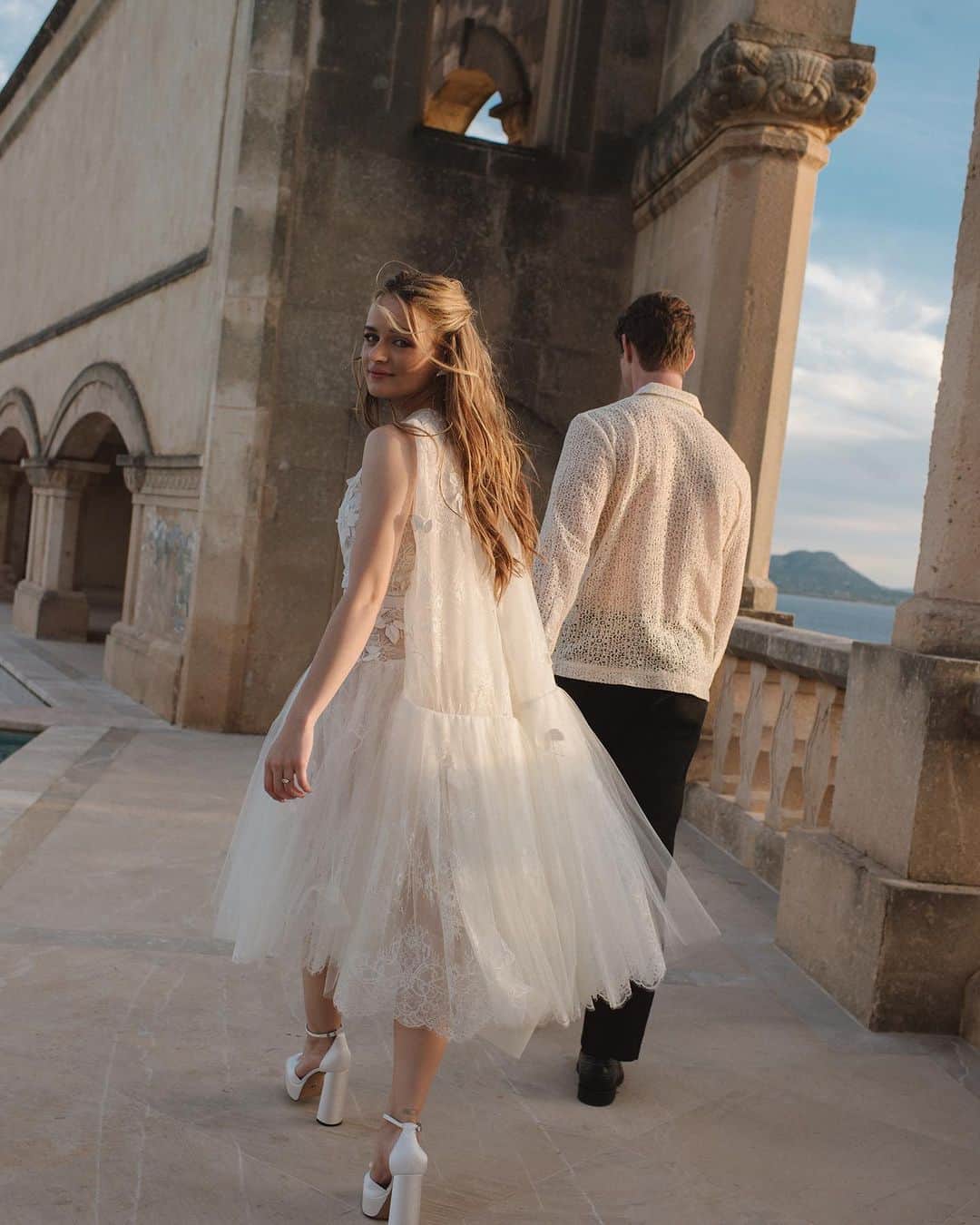 のインスタグラム：「A love affair. @joeyking stuns in the #odlrbridal tulle lace drop-waist dress and corseted tulle halter gown with embroidered silk vines for her rehearsal dinner and reception.  Photographed by @normanandblake Styled by @jaredengstudios」