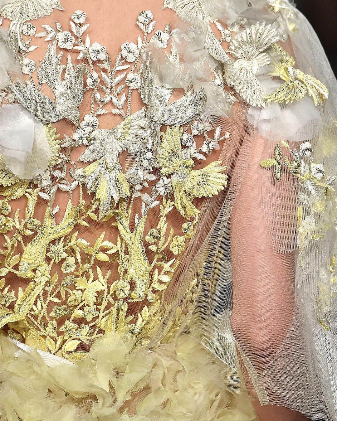 Marchesaのインスタグラム：「From the #MarchesaArchives, a detail shot of the pastel ombre ball gown with all-over hand-cut petals and blouson top with bird embroidery. #SS15Marchesa」