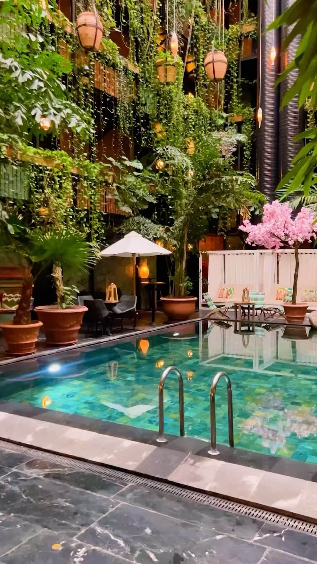 BEAUTIFUL HOTELSのインスタグラム：「@elisa.biagiotti is living the dream at Manon les Suites, Guldsmeden Hotels in vibrant Copenhagen, Denmark! 🇩🇰🏨 A stay that’s all about eco-conscious luxury, lush interiors and unforgettable city vibes. We can’t think of anything better than swimming in this Balinese-esque swimming pool after a day of exploring the city! 🌺  📽 @elisa.biagiotti 📍 @guldsmedenhotels, Copenaghen, Denmark 🎶 Enya - Sumiregusa (Wild Violet)」