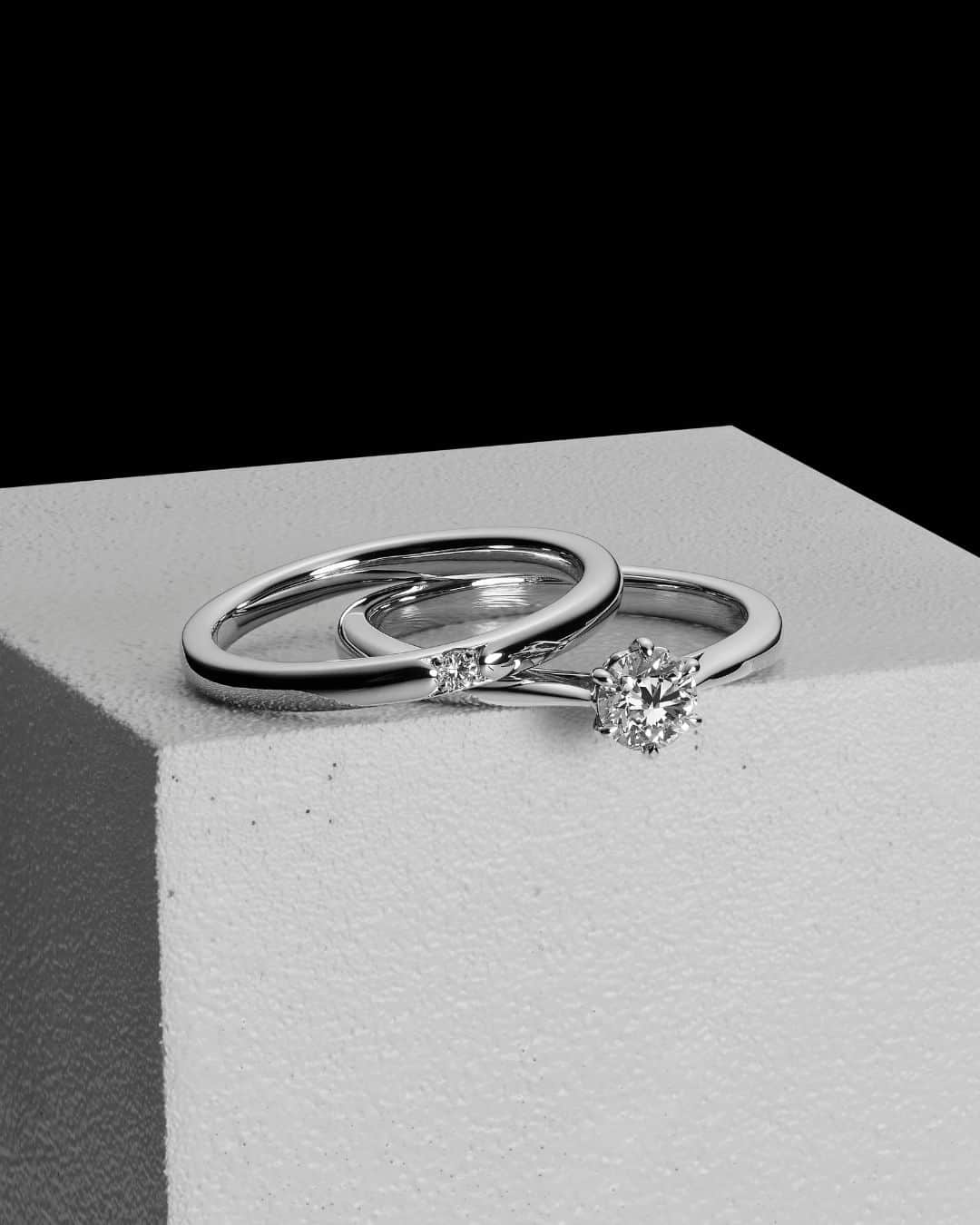 ラザール ダイヤモンド ブティック公式 | 婚約・結婚指輪のインスタグラム：「ー 極上のダイヤモンドに真実の愛を誓って ー   ラザール ダイヤモンド最大のこだわりである「カット」。  結婚指輪に使用されるメレダイヤモンドのカットにも 婚約指輪のセンターダイヤモンドに準じた厳しい基準を設定。  愛のシンボルとなるダイヤモンドの輝きを、あなたの薬指に。  ＜婚約指輪＞REVERENCE ＜結婚指輪＞HORIZON  #lazarediamond  #ラザールダイヤモンド  #婚約指輪 #エンゲージリング #結婚指輪 #マリッジリング #NEWYORK #NYC #ダイヤモンド #ダイヤモンドリング #ブライダルリング #ブライダルリング専門店」