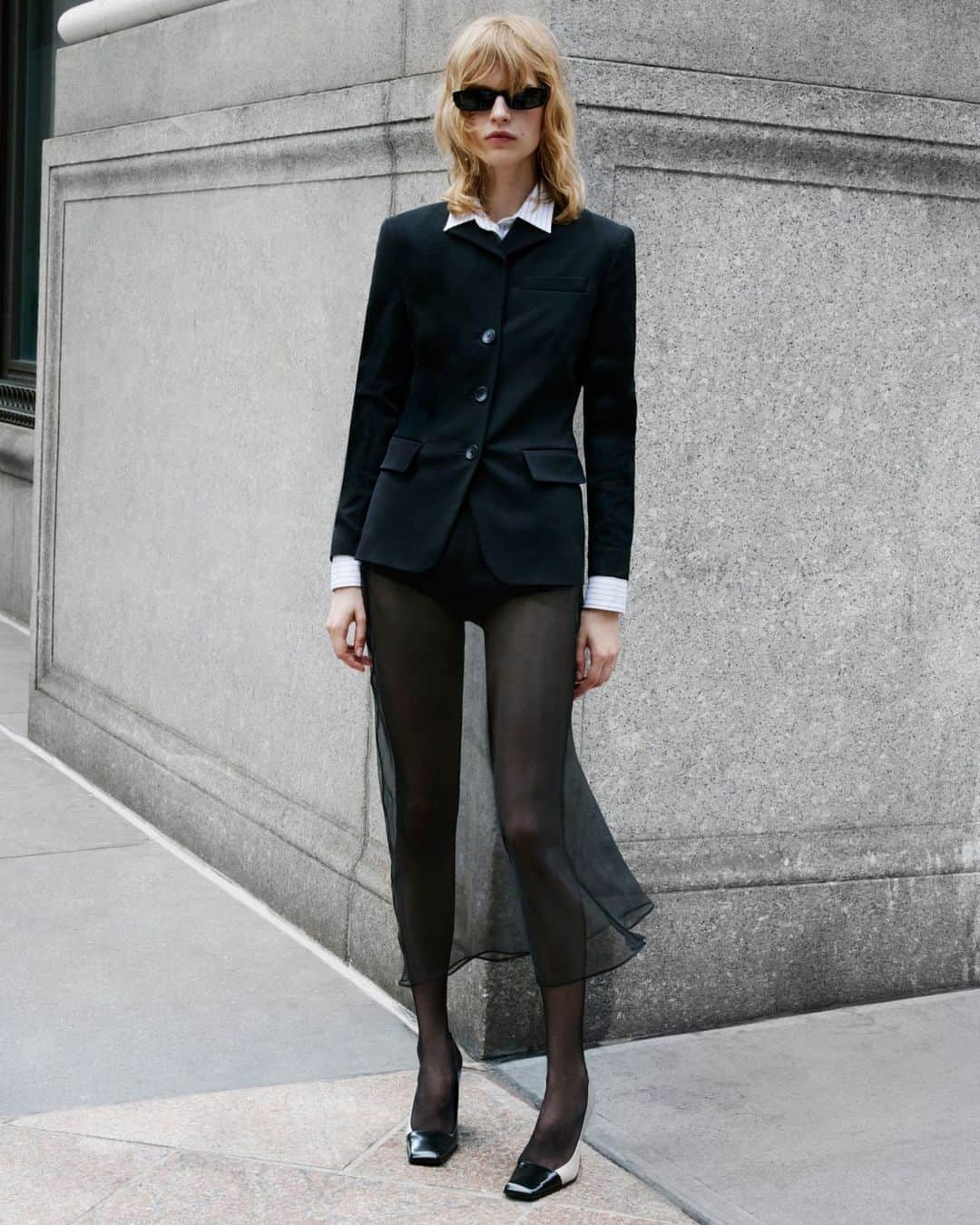 MANGOのインスタグラム：「This season's trends are all about giving (very) bold twists to your looks. Will you dare to try it? Get your wardrobe ready for a new era at mango.com. ⁣ Blazer: 57036013 ⁣ Shirt: 57045809 ⁣ Skirt: 57066019 ⁣ Panties: 57065809 ⁣ Tights: 57085801 ⁣ Shoes: 57096020 ⁣ Sunglasses: 57065794 #MangoWoman」