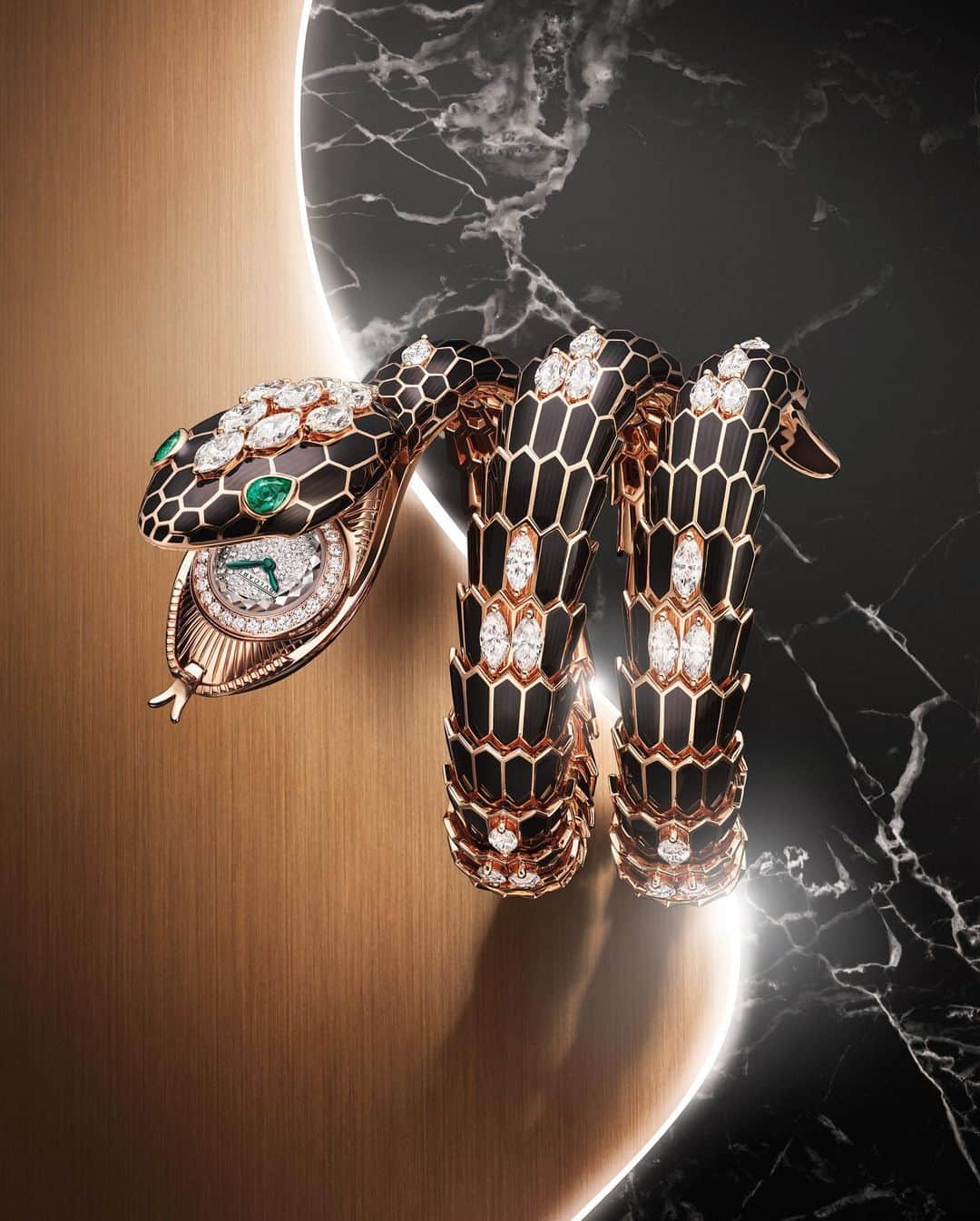 LVMHのインスタグラム：「Discover @bulgari’s creative innovations at Geneva Watch Days 2023.  Deep dive into the Maison’s marvellous Piccolissimo BVL 100 round miniature mechanial movement, the smallest on the market.  Two new models come to the fore: the Serpenti Misteriosi in white gold and the Serpenti Misteriosi in rose gold.   #LVMH #Bulgari」