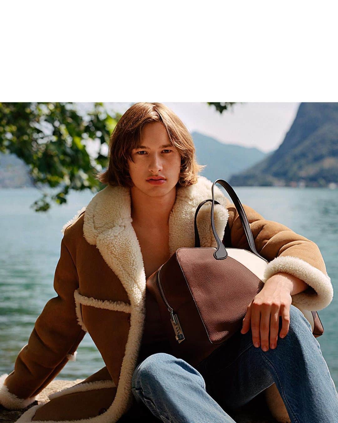 バリーのインスタグラム：「THE FALL/WINTER 2023 CAMPAIGN Lugano, Switzerland.  Design Director: Simone Bellotti Art Director: Christopher Simmonds Photographer: Alasdair McLellan  Stylist: Charlotte Collet  Casting Director: Ben Grimes Hair: Anthony Turner  Make-up: Lucia Pica  Model: Joseph Glasser   @alasdairmclellan, @charlottecolletcollet, @ben_grimes_casting, @anthonyturnerhair, @luciapicaofficial, @joseph.glr  #Bally #BallyFW23」