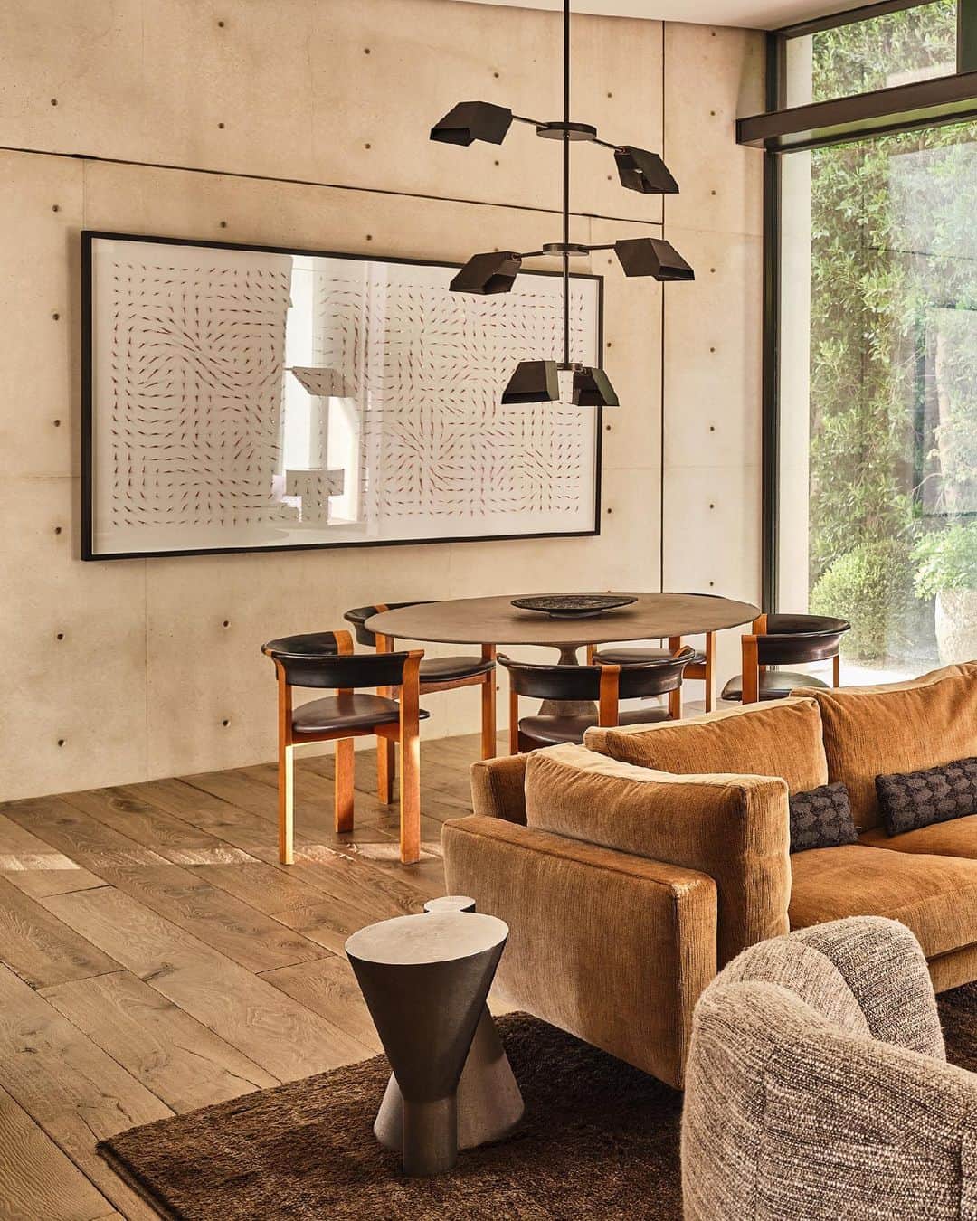 のインスタグラム：「INSIDE OUT For this spacious family room in a private residence in California. The space features large sliding glass doors that create a seamless connection to the garden. So, my team and I opted for an organic color palette to achieve a continuous flow effect. We curated a mix of emerging artists and vintage pieces, including a custom bespoke Fin Palm chandelier by Nader Gammas over the dining Clay Table by Marc Krusin, along with midcentury armchairs by Thygesen & Sørensen for Magnus Olesen. Complementing the space, a side table by Ida Elke and a coffee table from the collaboration between Aot and Yasmeen Hamouda. XK」