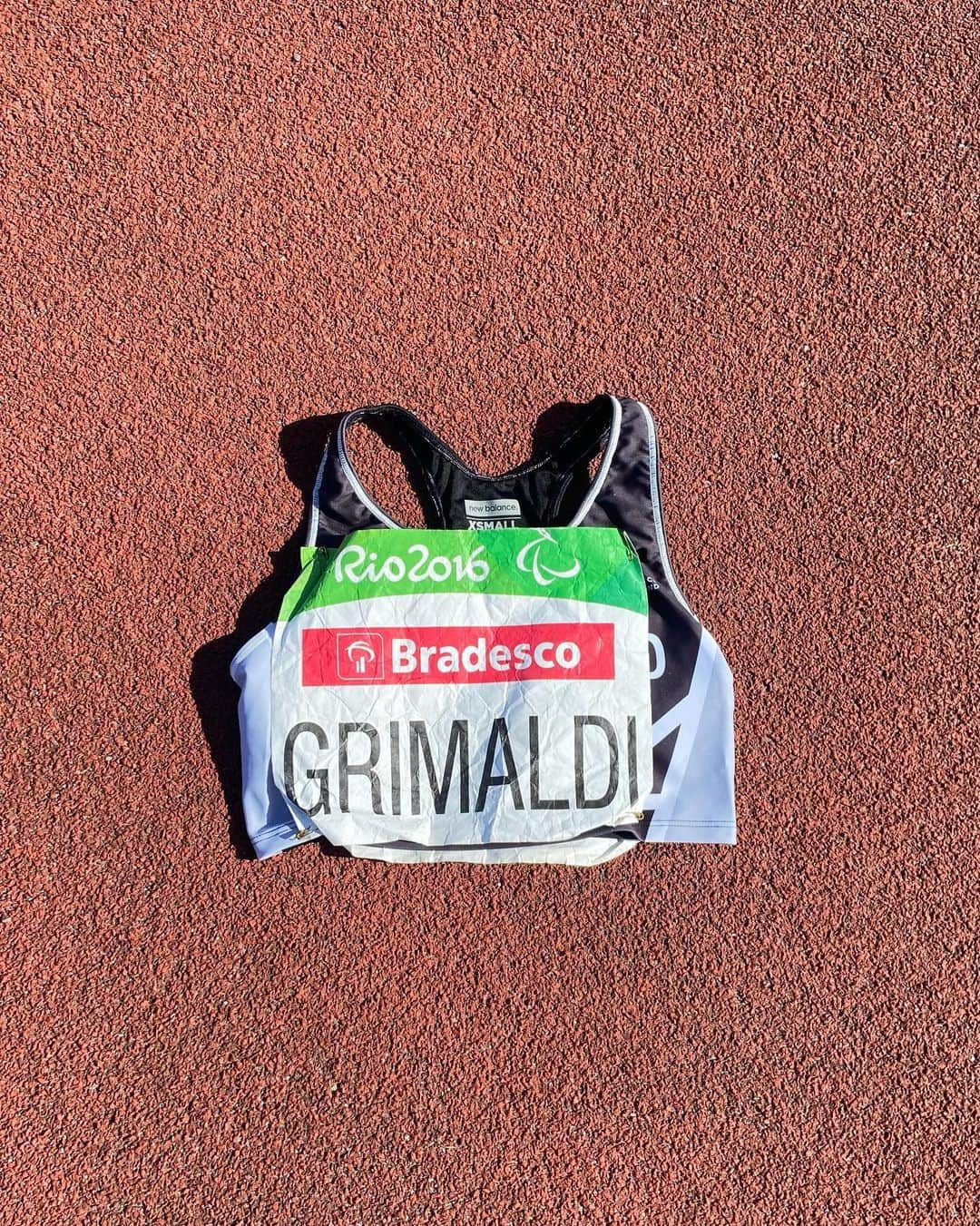 Anna Grimaldiのインスタグラム：「I became a Paralympian 7 years ago today.  This is the exact competition top and number, in the exact same position I wore it 7 years ago, when I won gold.  I haven’t actually looked at it since then if I’m honest.  7 years isn’t usually a significant milestone but it is for me.   7 years of being uncomfortable with being successful, questioning whether I was good enough to continue, whether there was a place for me here in high level sport and whether I was deserving of it all.  7 years of constantly chasing what I thought a gold medallist should look like, act like and sound like.  It’s been 7 Years since I’ve enjoyed this sport for more than the medals.   This years World Champs campaign gave me a lifeline in a sport that I thought I may never reach my full potential in. It’s allowed me to take up the space that has always been mine, I was just too scared to fill it.  Today, exactly 7 years since I wore it, I look back at this crop top and number and see the day my life changed for the better - the opportunities its given me, the people I’ve met and the places I’ve been, it’s all part of my story, and actually, it’s the most memorable part of it all.  Thank you to the Anna from 7 years ago, who put her self out there and flew just a little bit further than anyone else, I couldn’t be more proud of us, its just taken me 7 years to see it.  So happy 7 years to the gold medal and outfit that changed my life - that deserves to be celebrated.」