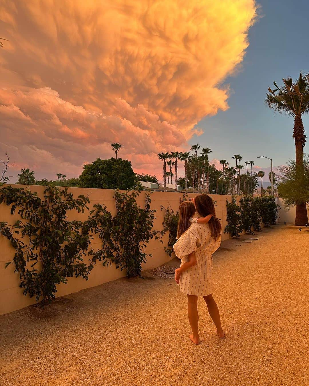 ケイラ・ユーウェルのインスタグラム：「The end of Summer & the beginning of my Birthday. ☀️   Sometimes you pack up the fam & take a last minute trip to Palm Springs right before school & a giant storm start.   Family time is my favorite time. The  kids loved every minute, including the car ride home. (We timed it perfectly & they slept the whole way home, little do they know that was the best present they could give.)   •Dress & shoes are @zara  •Jones’ trunks & oufit @zarakids  •Onesie is our favorite @kytebaby  •Bikini is @allsaints from a few years back & it’s still one of my favorites」