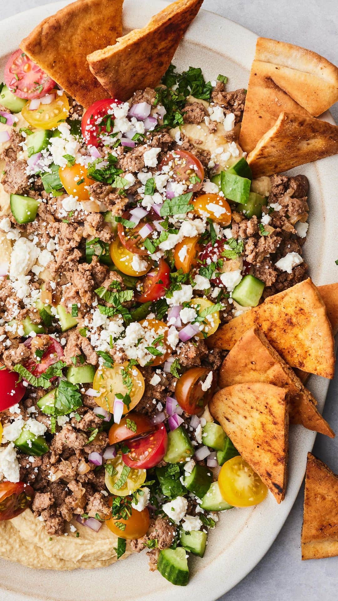Gaby Dalkinのインスタグラム：「Summer Hummus with Ground Lamb and a Tomato Cucumber Salad on top!」