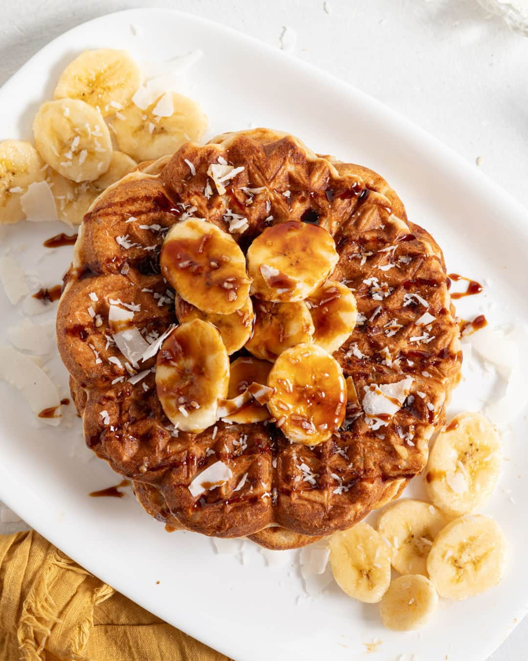 Food Republicのインスタグラム：「Coconutty Vegan Waffles Recipe   Not only does coconut milk keep these waffles vegan, but it also gives them the most pleasant coconutty flavor.  Recipe developed in collaboration with @crumblesofhealth.  Prep Time: 5 minutes  Cook Time: 15 minutes  Servings: 6 waffles  Ingredients: -1 ½ cups all-purpose flour -3 tablespoons sugar -2 tablespoons baking powder -½ teaspoon salt -1 ½ cups light coconut milk -2 tablespoons coconut oil + 1 teaspoon for greasing the waffle iron -2 teaspoons vanilla extract -¼ cup shredded coconut  Directions: 1. Preheat your waffle maker on a medium-high setting.  2. In a large bowl, combine the flour, sugar, baking powder, and salt.  3. To the same bowl, add the coconut milk, 2 tablespoons coconut oil, vanilla extract, and shredded coconut. Mix until a smooth batter forms.  4. Scoop about ¼ cup of the batter into the waffle maker. Cook until golden brown, about 1-2 minutes. Repeat with the remaining batter.  5. Serve warm with your toppings of choice.  -  #easybreakfast #breakfastinspo #breakfastrecipe #breakfastidea #breakfeastideas #breakfastinbed #breakfasttime #breakfastrecipes #healthybreakfast #breakfastrun #breakfastfood #breakfastofchampions #breakfastforchampions #breakfasting #breakfastisserved #breakfastonthego #breakfastforlunch #breakfastathome #breakfasttoday #breakfastallday #breakfastparty  #breakfastfortwo #breakfastdate #breakfastporn」