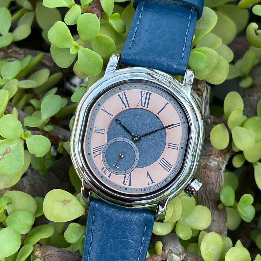 WATCHMANIAのインスタグラム：「The Western Brothers @twbwatch Cavalieria edition watch with an Oval shape 316L stainless case 41mmx38mm dress watch created with passion, In striking contrast between Salmon and Navy blue dial small seconds positioned at 7 o'clock, and crown at 4 o'clock with an open case back makes it a unique in design watch which stands out on your wrist. doors are open for pre order, to be delivered on 19th October 2023」