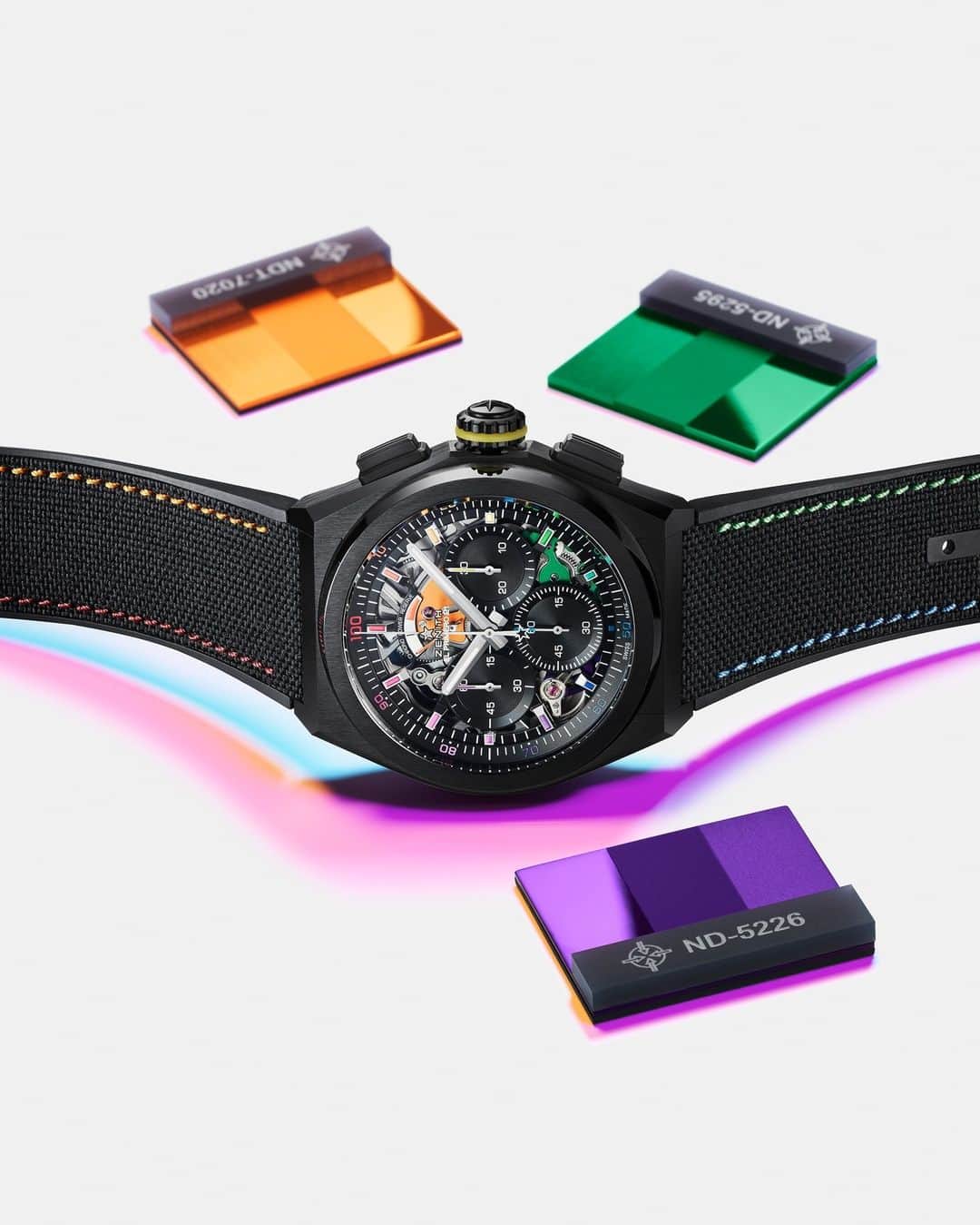 ゼニスのインスタグラム：「#Defy21Chroma: Chromatically supercharged: the matte finished black ceramic case of the DEFY 21 Chroma II gives way to a refracted rainbow spread evenly across the open dial, the tips of the hands and the movement, all in a perfectly transitioning gradient of colours spanning the entire spectrum.」