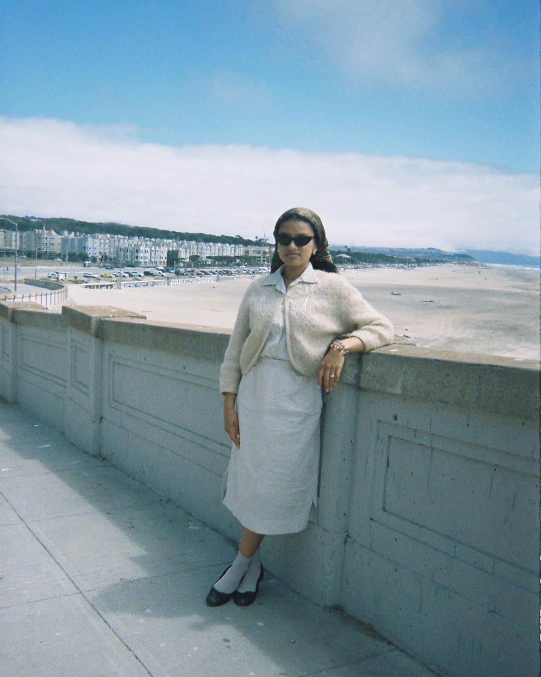 ティファニー・キャデラックのインスタグラム：「Got my disposable developed and it just came back. I love asking strangers to take my pictures. Thank you biker for the shot. I love how I dressed, almost blending in the background. I have brought offerings for the waters this day, the breeze was nice and it sprinkled a little after, sheltered at Safeway and bought a bottle of Sanpellegrino. Location is mid hill walking down from Sutro Baths ruins, Ocean beach.  #Kodak #35mm」