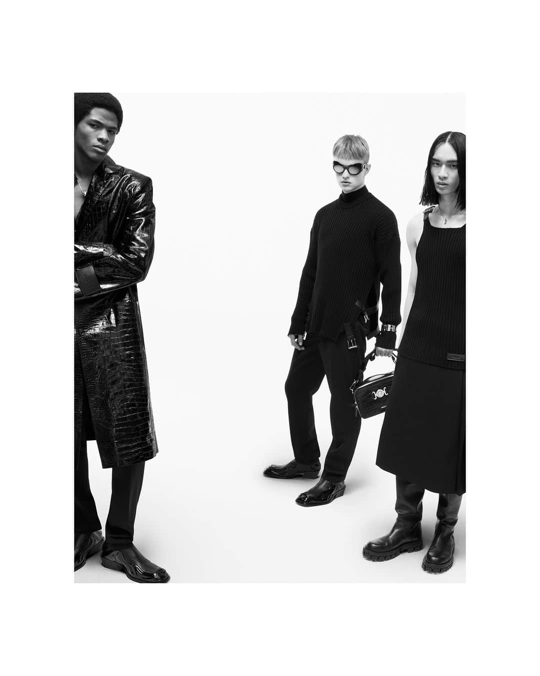 ジャンニヴェルサーチのインスタグラム：「Fall-Winter 2023 Campaign  Wylber wears leather coat; silk devoré shirt; pants; Solare boots - Mattias wears ribbed-knit sweater; mock-neck top; slim pants; Solare boots; Medusa Biggie crossbody bag - Donggyu wears ribbed-knit sleeveless top; skort; Greca Portico boots  Photography by Mert & Marcus  #VersaceFW23」