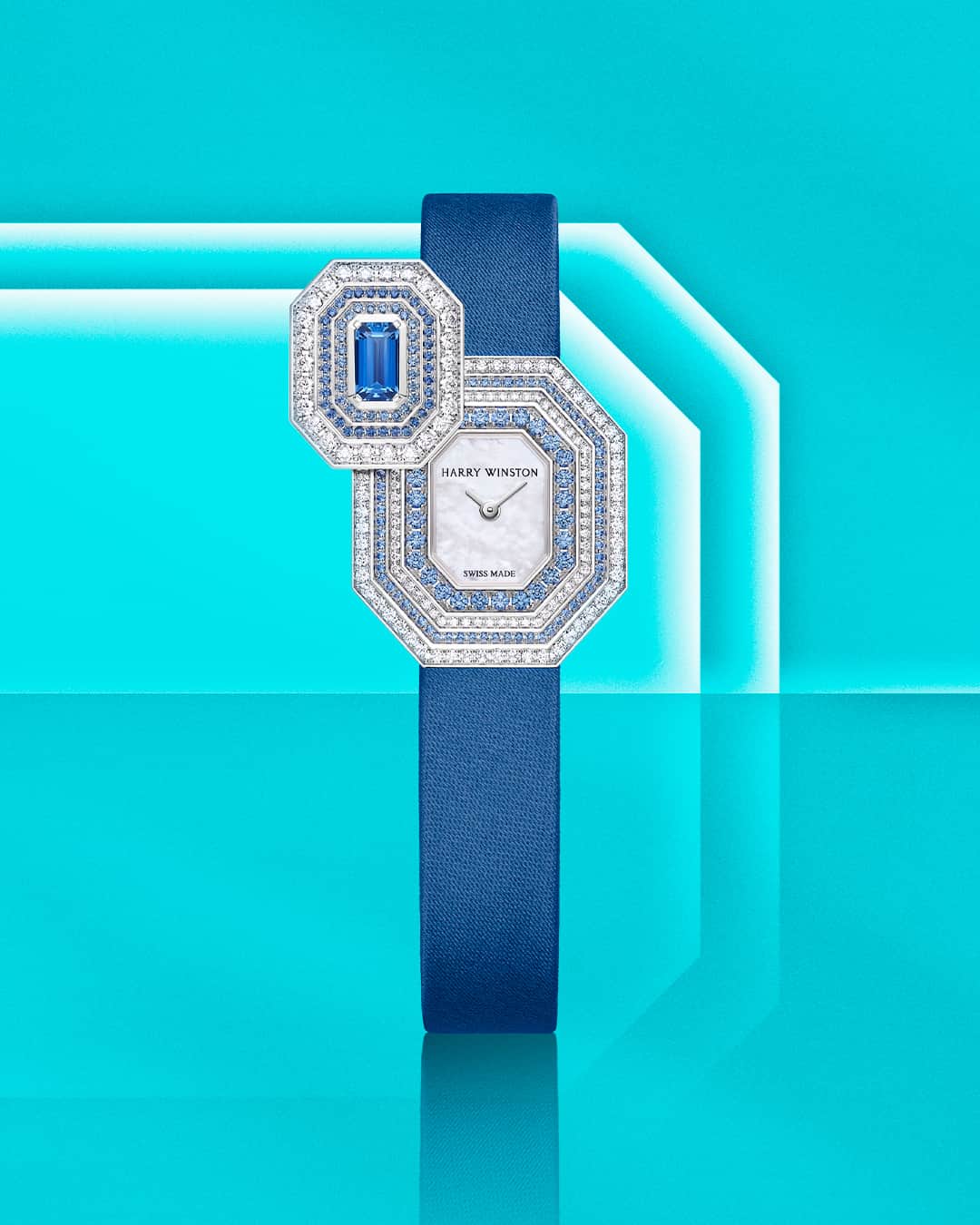ハリー・ウィンストンのインスタグラム：「With 158 sapphires arranged around its dial and a silk fabric bracelet in a vivid hue, this Emerald Signature timepiece signals that it’s time to embrace brilliant shades of blue. Tap the link in bio to accessorize with this enchanting watch. #HWEmerald #HarryWinston」