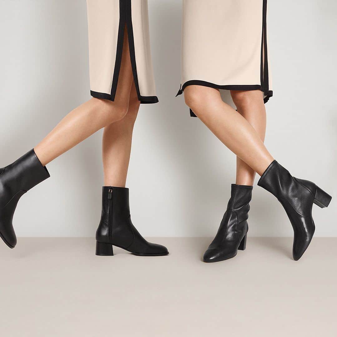 スチュアートワイツマンのインスタグラム：「Three words: Little. Black. Boots. Find your perfect pair from our curated range of styles featuring any heel height, toe shape and material you could ever want. Pictured here: Our new NOLA ZIP BOOTIE in black sport calf leather and best-selling YULIANA 60 BOOTIE in black stretch nappa leather. The Little Black Boots Capsule is now available to shop on stuartweitzman.com.​  ​  #StuartWeitzman #NOLA #YULIANA​」