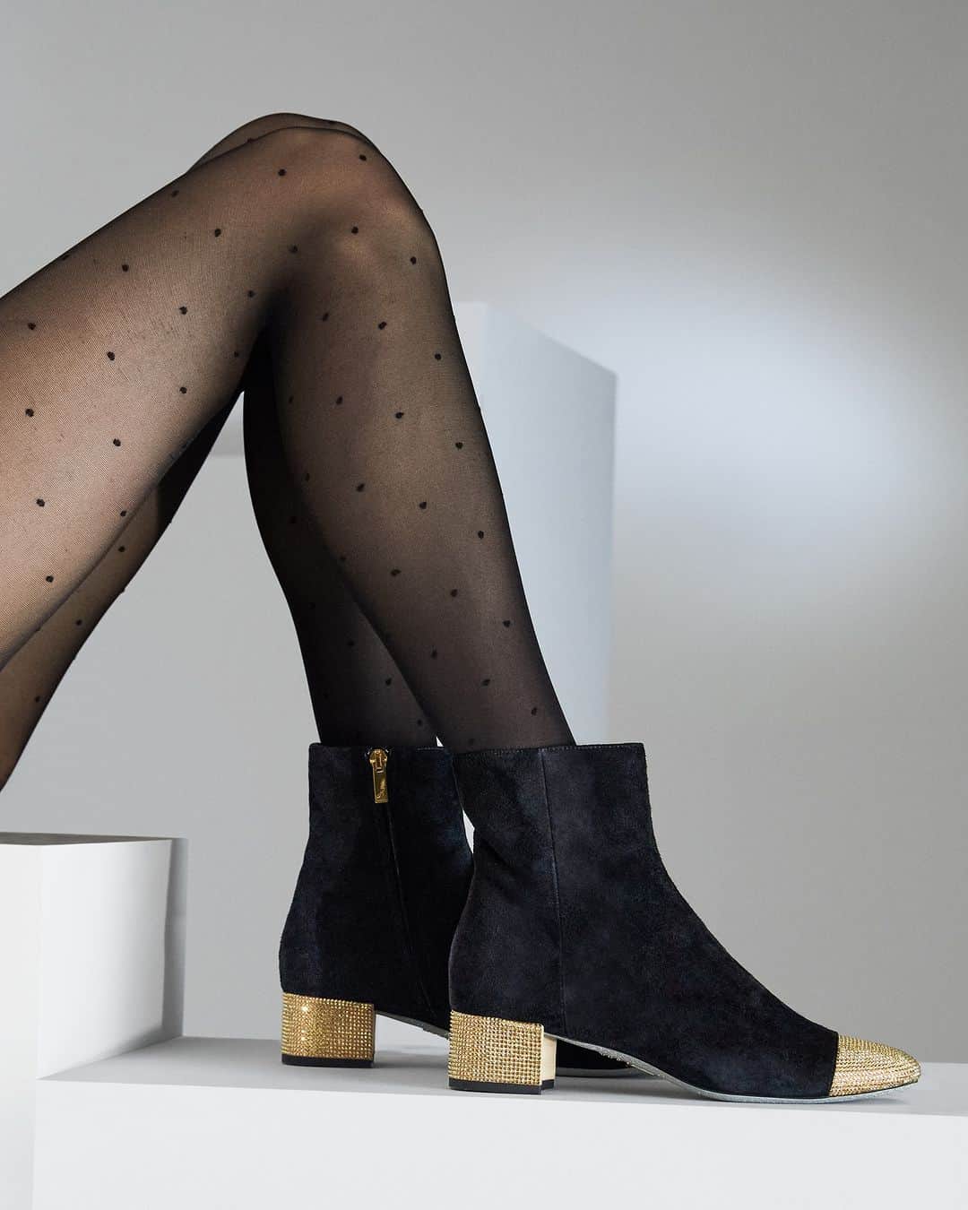 のインスタグラム：「The season’s confident, modern spirit steps out in block heel ankle boots with shiny details.   #ReneCaovilla」