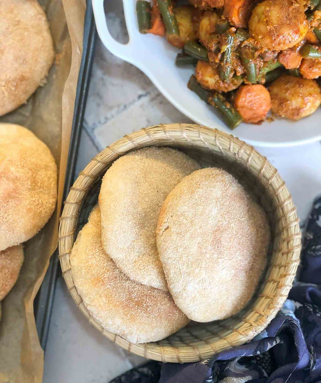 Archana's Kitchenさんのインスタグラム写真 - (Archana's KitchenInstagram)「Goan Poee Recipe is a Goan whole wheat bun made with wheat flour, all purpose flour and wheat bran hence making it absolutely delicious for a Saturday dinner with any spicy gravy of your choice!  Ingredients 1 cup All Purpose Flour (Maida) 1 cup Whole Wheat Flour 1/4 cup Wheat Bran 1-1/4 teaspoon Active dry yeast 1/4 teaspoon Sugar 1/2 teaspoon Salt 1 cup Water , lukewarm  👉To begin making Goan Poee Recipe-Yeast Bread Recipe add all the ingredients listed in a standalone mixer. Mix for about five minutes till all the ingredients are well combined. 👉You can optionally add all the ingredients in a bowl and add little water at a time and knead to make a smooth poee dough. 👉Apply some oil at the top of the poee dough and keep it aside to rise until the dough doubles in size; for about 2 hours. 👉Once double in size remove the dough onto a flat surface and punch out the air. Divide the dough into 12 equal portions, shape them into balls. 👉Dust the rolled balls on wheat bran, roll them lightly to a 3 inch diameter discs and place them on the baking sheet. 👉Allow the bran dusted poee bread to rise again for another 1 hour.  👉Once the Poee bread have risen, preheat an oven to 220 degree Celsius for ten minutes. Place the Goan Poee to bake for six to eight minutes until golden brown. 👉Do not bake for too long as poee will crisp up and become hard. 👉Once done, remove from the oven and serve hot.」8月26日 20時30分 - archanaskitchen