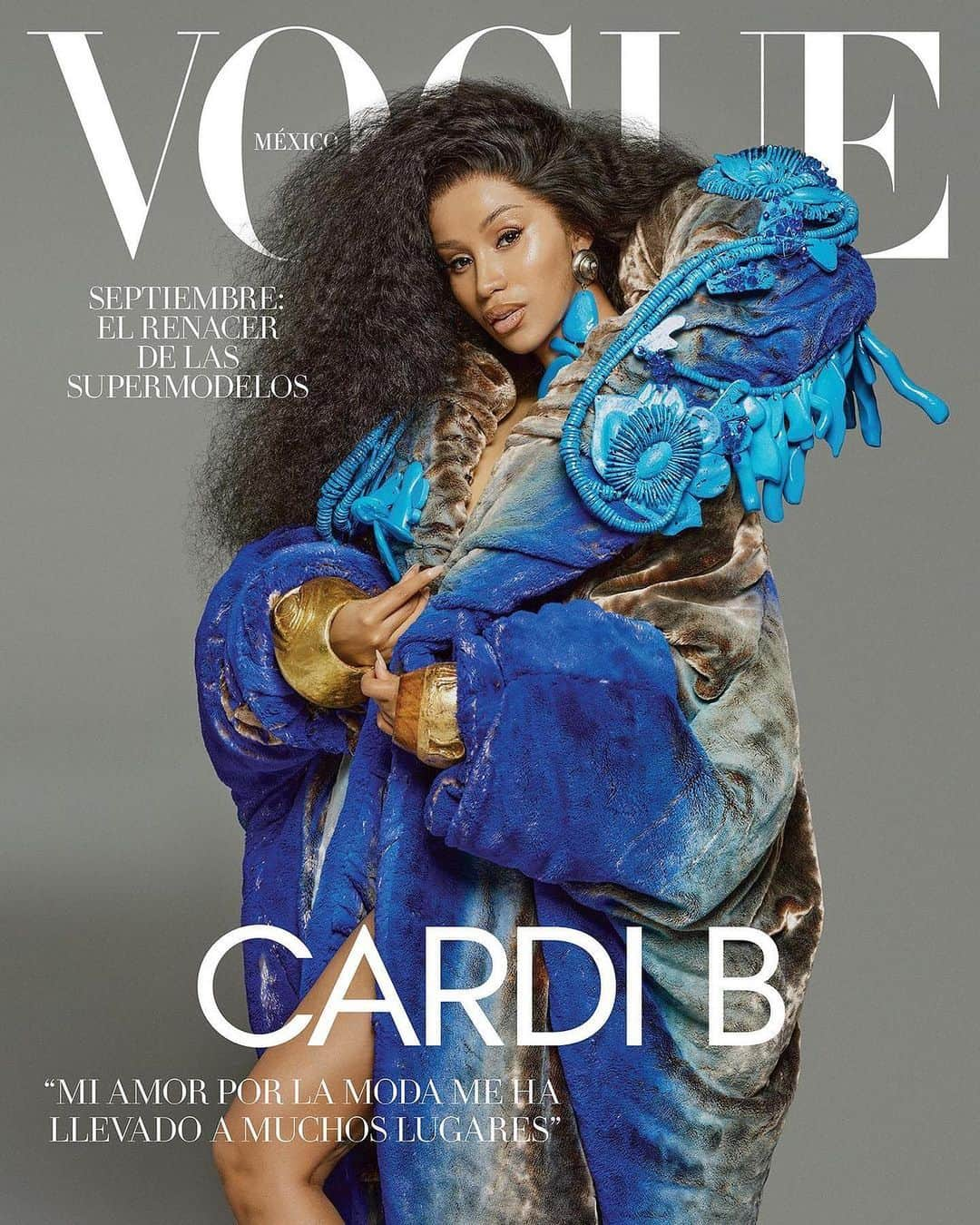 スキャパレリさんのインスタグラム写真 - (スキャパレリInstagram)「@iamcardib on the cover of @voguemexico in the brown velvet astrakhan faux fur wrap coat with handpainted gradient blue, an abstract necklace in wood, metal and crystals, paired with cuffs in wood and Schiaparelli Gold.  Swipe to see the @schiaparelli Haute Couture FW23 process with @danielroseberry, @caren_jepkemei and @chuol_nnyawurh, from the fittings to the runway.  Photographer @alique_studio  Stylist @praymoses.studio @kollincarter   #Schiaparelli #CardiB」8月26日 16時29分 - schiaparelli