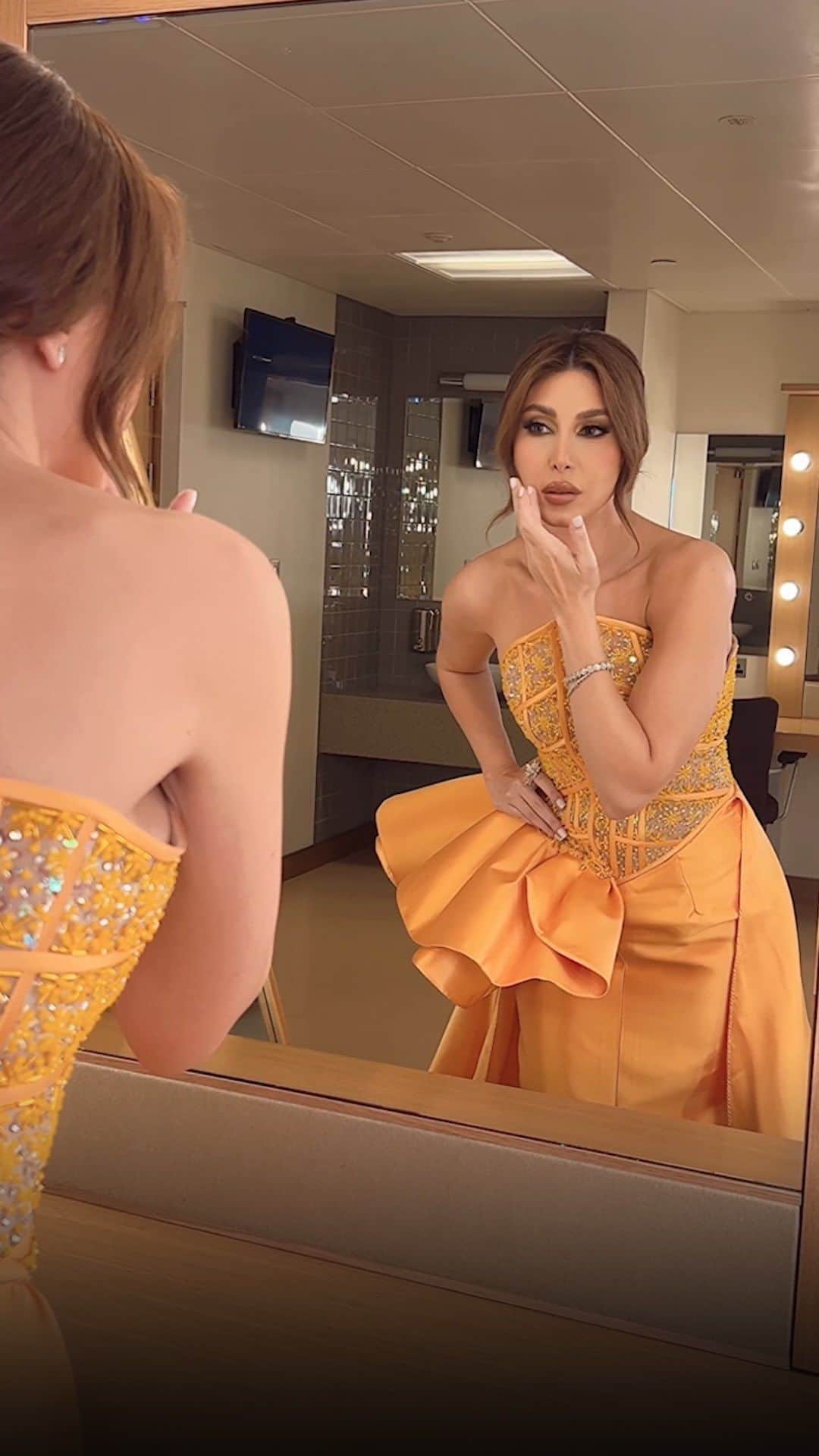 ヤーラのインスタグラム：「Glammed up and ready for tonight’s wedding 🧡✨  Thank you @charbelzoecouture for the stunning custom-made dress 😍  Jewlery: My collection #LoveMeLoveMeNot 🌼 @samrajewellery Makeup: @alberto_makeup Hair: @wassimsteve  Contact lenses: My collection “DOVE GRAY” @samacontactlens 👁   #Yara | #يارا」