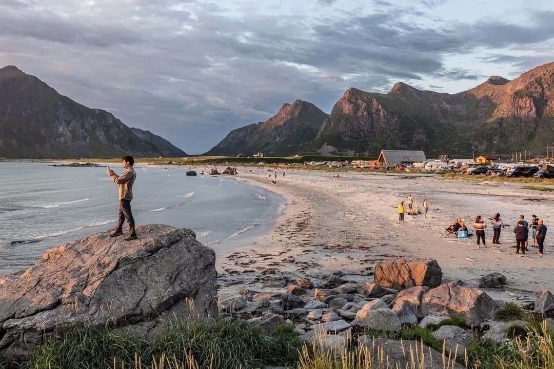 National Geographic Travelさんのインスタグラム写真 - (National Geographic TravelInstagram)「Photo by @paoloverzone | Skagsanden Beach, nestled in the picturesque Lofoten Islands in Norway, is a captivating natural wonder that entices locals and travelers alike. This pristine stretch of coastline boasts a unique phenomenon. During the summer months, as the midnight sun sets below the horizon, it bathes the beach in a golden glow that seems to stretch time. The play of colors across the sky creates a surreal ambiance, casting a spell over those fortunate enough to witness it.   Follow @paoloverzone for more images and stories.」8月27日 1時30分 - natgeotravel