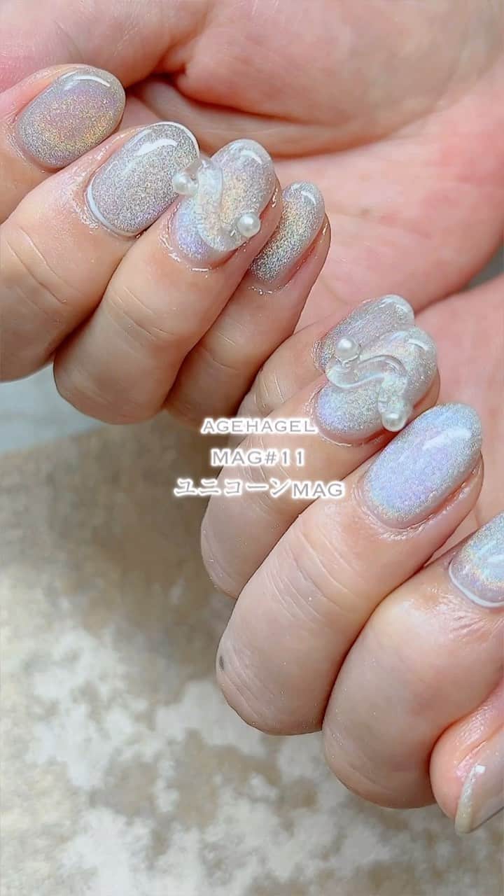agehaのインスタグラム：「写真撮影で難しい ユニコーンMAG🦄  動画と静止画で^ ^  agehaMAG11番の ユニコーンカラーを ベースカラー無しでやりたい！ とのリクエスト！  カスタムジェルで作った 濃いめ3杯バージョン  カスタムジェル めっちゃ使えるよーー😍  おかげでMAGがまた 最人気です♡  シンプルだから こだわりたい お客様に合わせた サロンオリジナル。  #agehagel  #MAGパウダー11 #ミキシングカスタムジェル #サロンオリジナル」