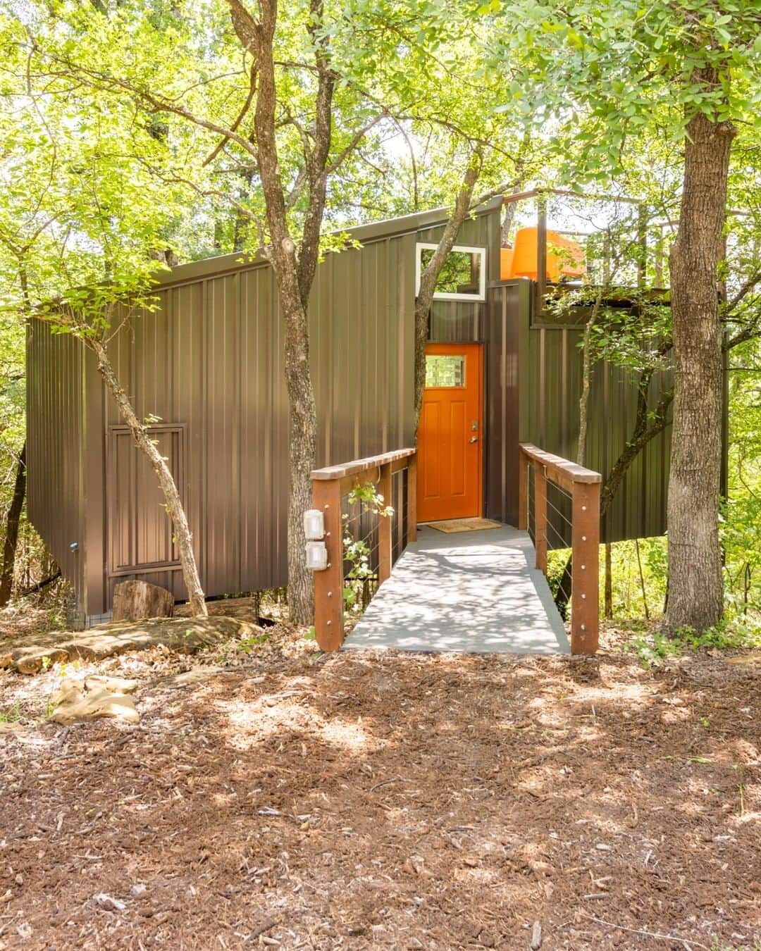 Airbnbのインスタグラム：「A treehouse with a modern Scandinavian design, overlooking the Texas woodlands.  This home can be found in our Adapted Category. Each home in this category receives a 3D scan and detailed Accessibility Review, and includes listing photos of features with key details like doorway widths that have been reviewed and confirmed by Airbnb.」