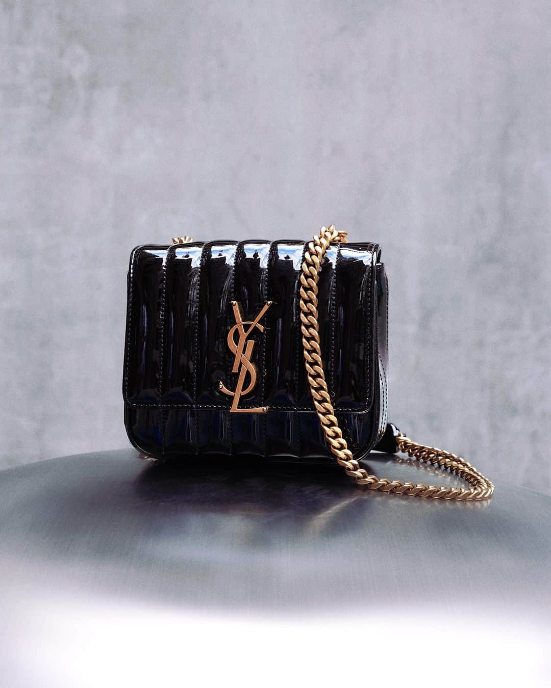 MATCHESFASHION.COMのインスタグラム：「Finish your look with @ysl’s Vicky quilted patent-leather bag.  Tap to shop.」