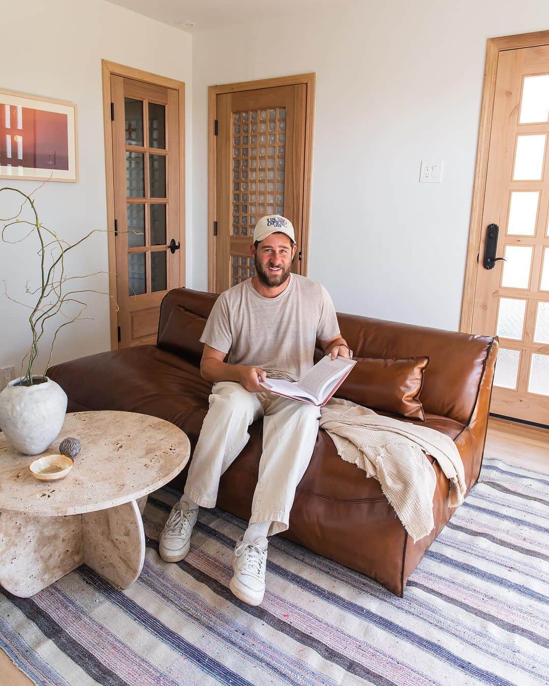 ホイットニー・ポートのインスタグラム：「Knock. Knock. 🚪 Ever wonder where our YouTube magic comes from? Welcome to Timmy’s Den!   @emtek_products: door hardware @industrywest: couch @bedrosianstile: bathroom tile @deltafaucet: plumbing fixtures @eternitymodernhome: Tim's desk chair」
