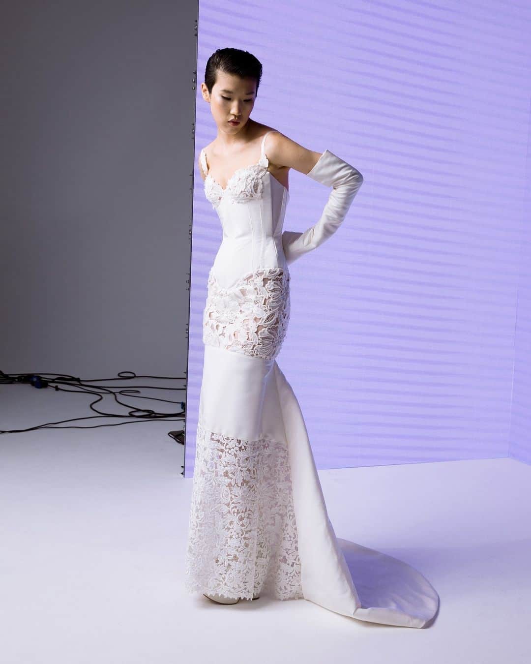 のインスタグラム：「Our Lyra gown is an elegant bridal patchwork look with minimalist straps, featuring two delicate floral guipure laces, heavily encrusted with pearls and a silk taffeta mermaid kick train. The classic waspie corset, with defined boning, accentuates the slim silhouette cinching the waist.⁠ ⁠ #VWBridal #WestwoodBridal」