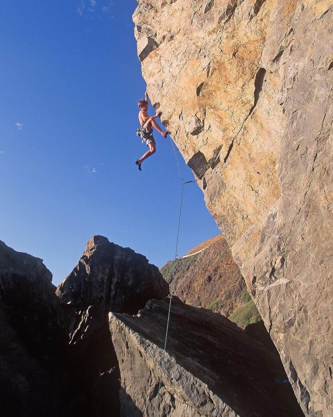 クリス・シャーマさんのインスタグラム写真 - (クリス・シャーマInstagram)「Repost from @jimthornburg • I found and scanned some old shots of @chris_sharma today. As I was looking through them, I was reminded just how different Chris’ climbing style was from other top climbers from that era. It’s true that his feet slipped and cut a lot when he was starting out. It’s also true that his technique was more dynamic than anyone else’s at the time and that he progressed through the grades faster than anyone ever had—in just two years he went from 5.11 to 5.14c. That would be impressive in any era, but 30 years ago nothing like that had happened and it scrambled a lot of brains. 1+2. 1st ascent of Necessary Evil (5.14c) at age 15. 3. 1st ascent of Yo Mamma (13a) at The Pinnacles, 1995. 4. On an early ascent of Lardbutt (13c), 1994 (age 13). 5. 1st ascent of Ubermensch (14a) Pinnacles, 1996. 6. Mickeys Beach Arete (13c) 1995. 7. Surf Safari (13d) 1995. 8. Getting a big head, 1994. 9. Supertweak (14c) 2nd ascent, 1996. 10. Trying Biographie extension (5.15a) in 1997 (he made the FA 4 years later). #climbinghistory #climbingphotography #goat #rockclimbing #chrissharma」8月31日 5時59分 - chris_sharma