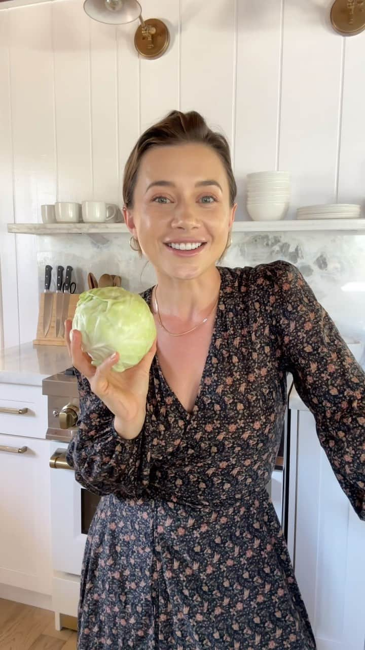 オレーシャ・ルーリンのインスタグラム：「The long-awaited recipe for Russian cabbage soup is finally here. “ SHI” is made in my house at least once a week. My one year old daughter loves, my 80 year old neighbor (who hates vegetables) loves it, so give it a shot, even if you think cabbage does not sound enticing. Today’s recipe is vegan but if you’d like to add meat, a small piece of pork added to the beginning, creates and more full bodied broth. I hope you enjoyed the soup. Please let me know in the comments below if you’ve tried to make it and what your thoughts are.   * I’m wearing a beautiful dress from @christydawn one of my absolute favorite clothing brands because of their regenerative initiative when it comes to clothing. Use my code 15OLESYA if you’d like to discover the brand.  * Our pots and pans are from @caraway_home and are truly one of the best investments in our kitchen if you’d like to upgrade your kitchen essentials, feel free and use my link in bio  for 10% off at check out.」