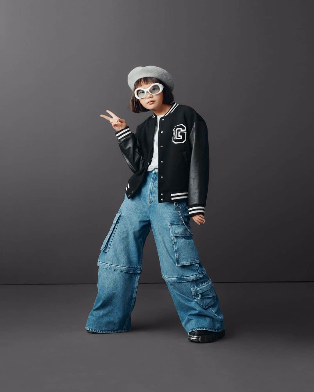 GapKidsのインスタグラム：「Nobody does original like Coco Pink Princess 🕶️ Seen here in The Varsity Jacket and The Project Gap Baggy Cargo Jean.」