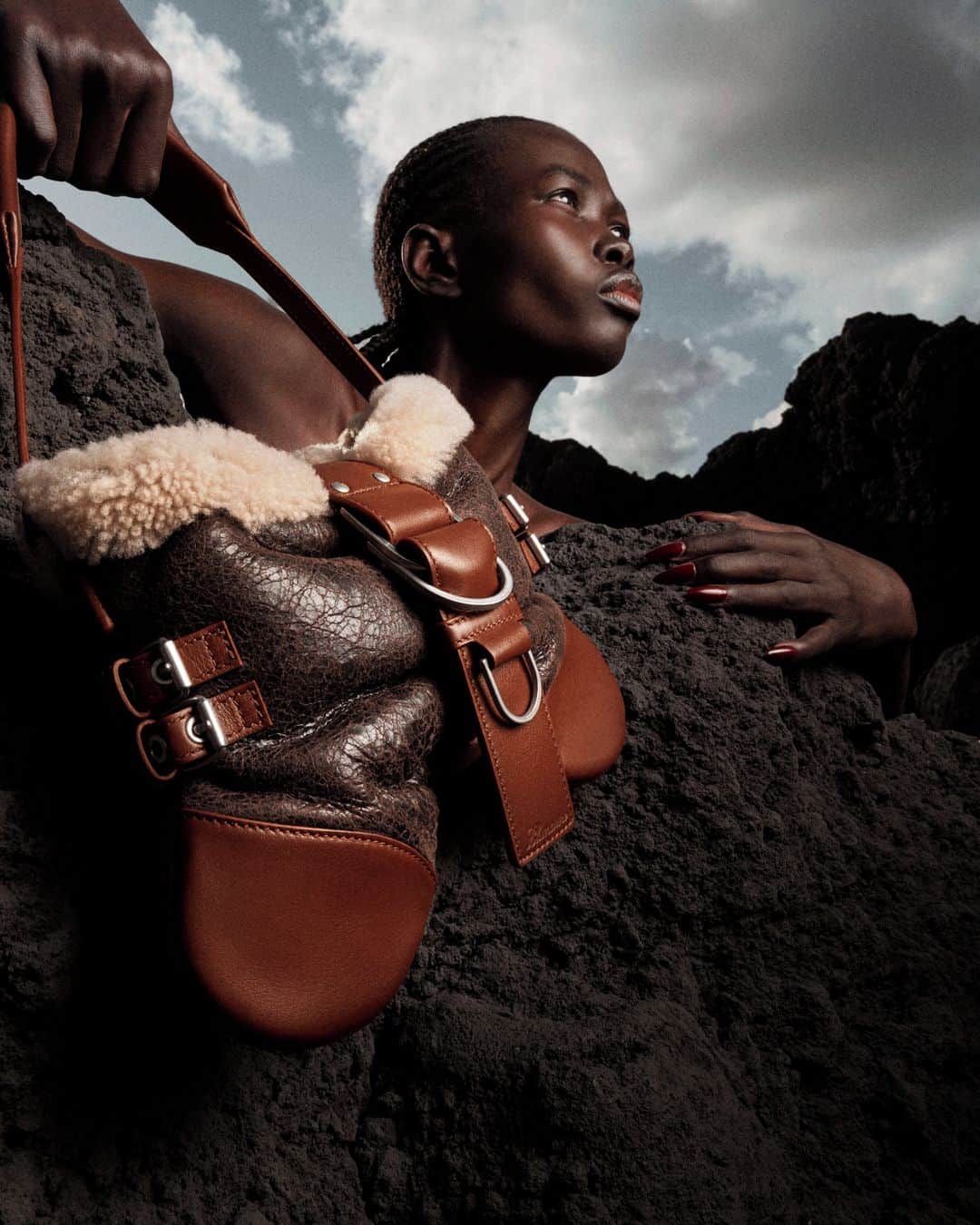のインスタグラム：「A VOLCANIC TALE, FALL WINTER 2023⁣ ⁣ Explore the bags and shoes from Blumarine Fall Winter 2023 collection by @nicola_brognano⁣ Now available at blumarine.com⁣ ⁣ Photographer - @alfonsoantoncornelis⁣ Art Direction and Styling - @gio.a.b⁣ Talent - @mckellyayor⁣ ⁣ #Blumarine #BlumarineFW23」