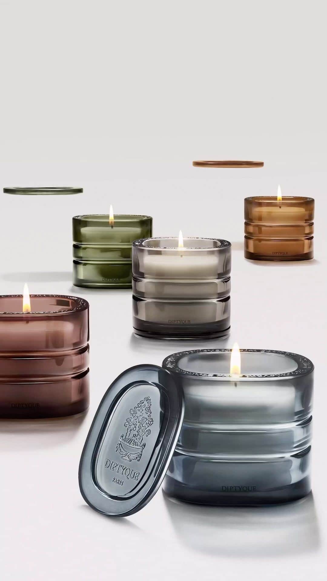 ディプティックのインスタグラム：「At the heart of the coloured oval… …a flame, and a scent. The designer Cristina Celestino drew inspiration from the Maison’s emblematic shape to create this monolith of coloured glass. Once lit, each candle evokes the soul of an extraordinary place. An elsewhere of untouched beauty. @cristinacelestino #LesMondesDeDiptyque #PremiumCandles #Candles #Diptyque」
