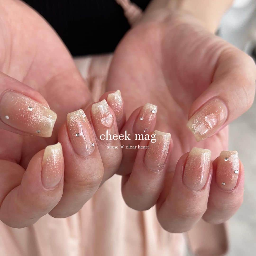 sapporo nail 【 Aster 】のインスタグラム：「⁡ cheek mag 🍑 ぷるんとクリアなハートのパーツとぴったり🤭  チーク部分、イロチガイにしてもかわいいかも、？🤔 ⁡ ⁡ ⁡ ________________________ ⁡ ⁡ ⁡ ⁡ ●ジェルの持ちが悪い ●爪が折れやすい ●爪を削られすぎたことがある ●マシンが怖い ●理想の形やデザインにならなかったことがある ⁡ ⁡ ↑お悩みの方はぜひ一度お任せください◎ ⁡ 『厚塗りすれば折れない』は×です👀 正しいフォルムとジェルの選定で お客様それぞれに合った理想の強度とキレイな見た目に整えます。 ⁡ ⁡ ⁡ ⁡ ⁡ _______________________________ ⁡ ⁡ #札幌ネイルサロンアトリエリベルテ #札幌ネイルサロン #ニュアンスネイル  #マグネットネイル #チークネイル #ハートネイル #マグネットフレンチ  ⁡ ⁡ ⁡ ⁡ ＿＿＿＿＿＿＿＿＿＿＿＿＿＿＿＿＿＿＿＿ ⁡ atelier Libertéはスタッフそれぞれがサロンの1席を借りてオーナーとして営業している新しいstyleのネイルサロンです。 ⁡ 使用素材や得意とするアートのタッチはスタッフにより異なります。 各スタッフのアカウントで、アートの雰囲気を見てご指名でのご予約もおススメです🪄 ⁡ ⁡ yukina→@atelier_liberte_yukina  akari→ @atelier_liberte_akari ayuzu→ @atelier_liberte_ayuzu saaya→ @atelier_liberte_saaya yuho→ @atelier_liberte_yuho ⁡ ●前日キャンセルはお席代として1500円/当日キャンセルは2,000円(無断の場合は3,000円)次回ご来店時にご請求させていただきます。(seina指名の場合、予約コース最低料金となります。例ハンド付け替え→7,000 ) ⁡ ⁡ 𝐚𝐭𝐞𝐥𝐢𝐞𝐫 𝐋𝐢𝐛𝐞𝐫𝐭𝐞 ⁡ place: 札幌市中央区南1条西8丁目9 BB1・8ビル2階 ⁡ TEL :  080-4500-8832 ⁡ ⁡」