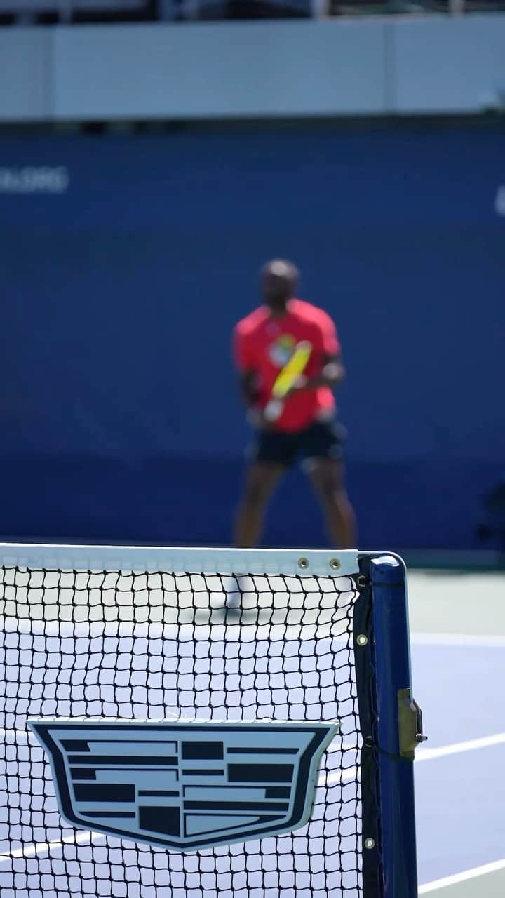 キャデラックのインスタグラム：「From the courts to the stands, we’re serving up big dreams and bold ambitions! Cadillac is proud to sponsor the 2023 US Open happening this week in NYC. Take a walk through the future of EV at Cadillac ELECTRIQ Theater, see Frances Tiafoe @bigfoe1998 play live and immerse yourself in an iconic stadium takeover. Join us to experience all the action! #BeIconic」