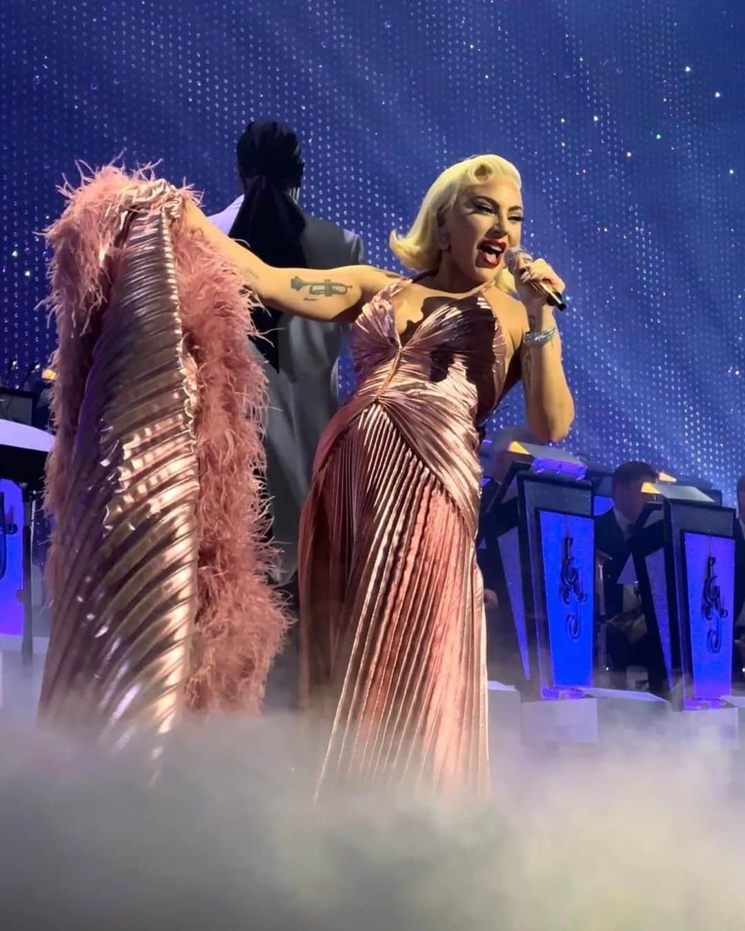 プラバルグルンのインスタグラム：「Lovely Lady⁠ ⁠ @ladygaga wears Atelier Prabal Gurung Rose Gold Sunburst Pleated Silk Lamé Gown with Hand Embroidered Crystals and Feather Trimmed Cape during her Las Vegas Residency: Lady Gaga: Jazz & Piano⁠ ⁠ Styled by @sandraamador.xx @tomeerebout」