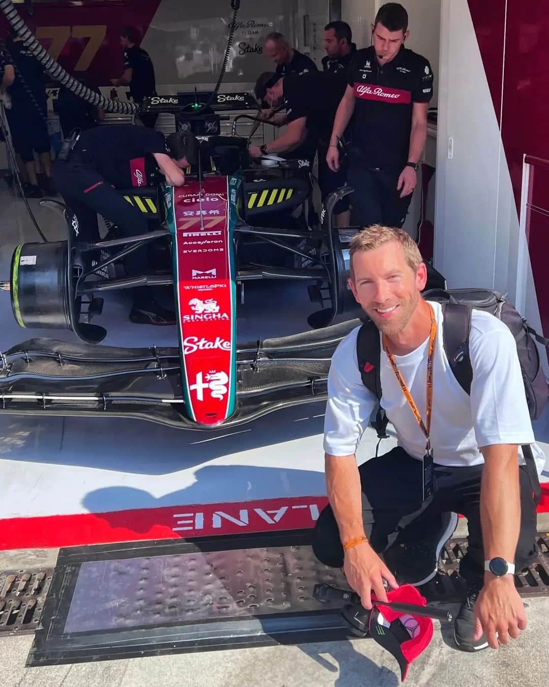 Rich McCorのインスタグラム：「A Ferrari Red hot weekend in Monza 🔥  Out of all the things I get to do with my photography, getting up this close to the action in Monza is right up there. I'm over here with the team from @ferraritrento, the official sparkling wine of @f1 (that you'll see the drivers celebrate with on the podiums). It's an incredible atmosphere and as a bonus it was fantastic to see @carlossainz55 take pole yesterday - to hear the Tifosi roar in person was something special.   (Oh and yes, that is me trying to discreetly hide my @mercedesamgf1 cap while in the Alfa Romeo garage 😅)  #ferraritrento #ferrariatrentof1 @clementinecommunications  Press Trip」